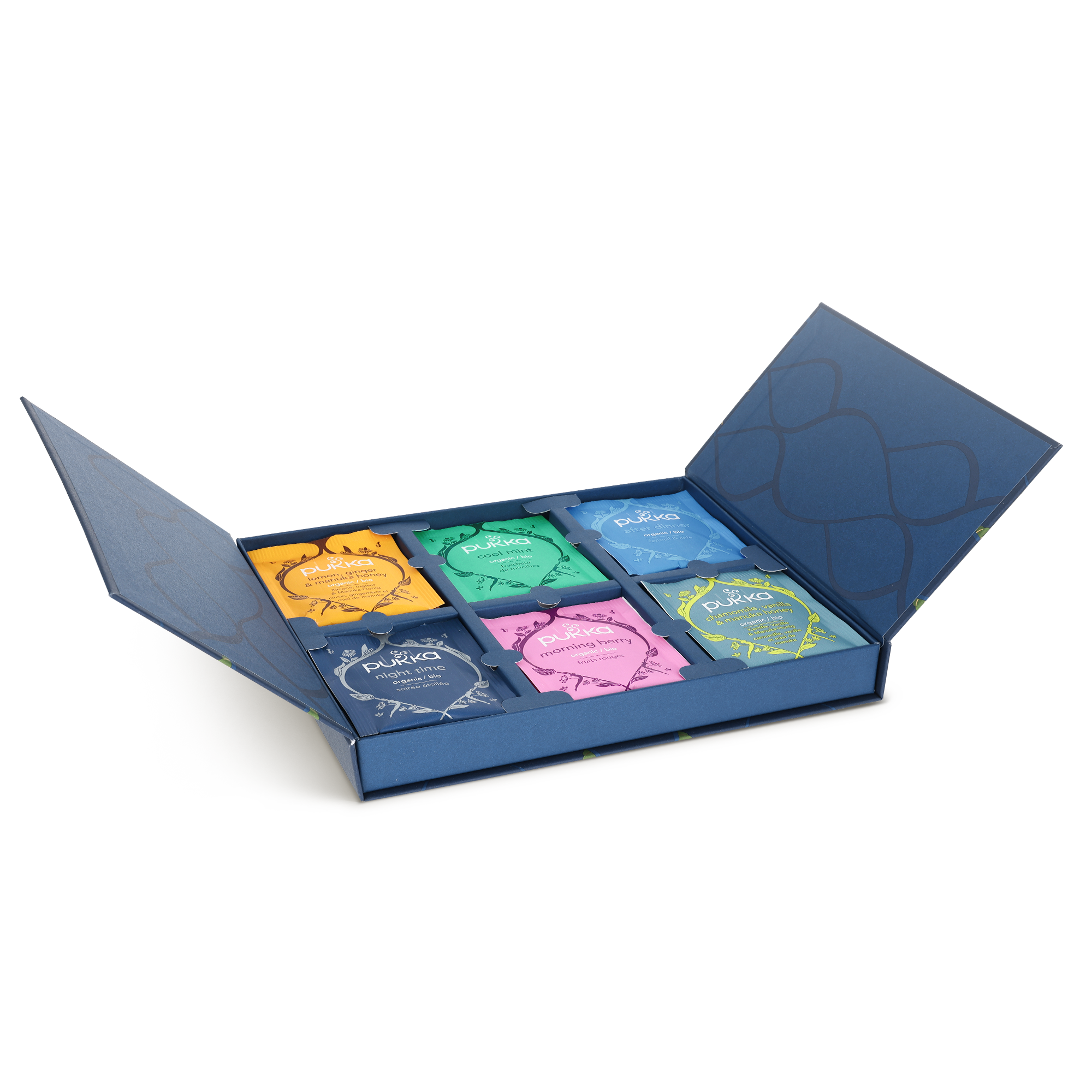 Cutie albastră cu capac deschis, conținând șase arome de ceai Pukka, pentru un set cadou personalizat de ceai Pukka.