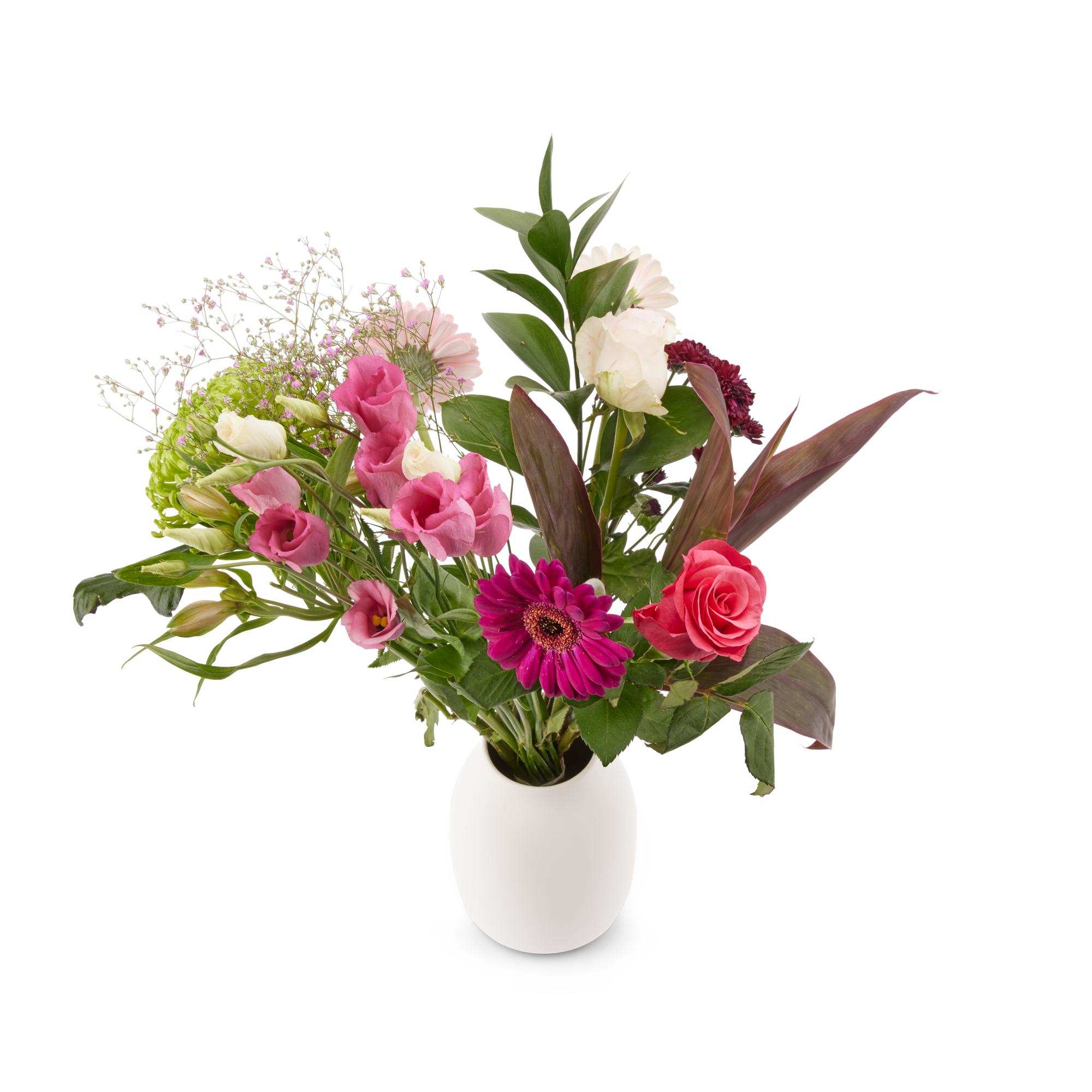 Een prachtig roze plukboeket met diverse bloemen en frisgroen blad in een witte vaas, inclusief gratis cadeaukaartje voor een persoonlijke boodschap.