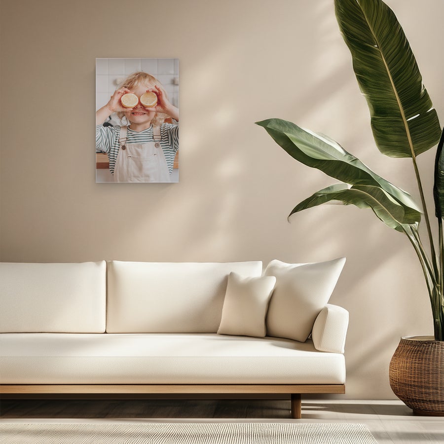 Personalised photo canvas A custom photo canvas of a child holding lemon halves over their eyes, printed with a personalized photo