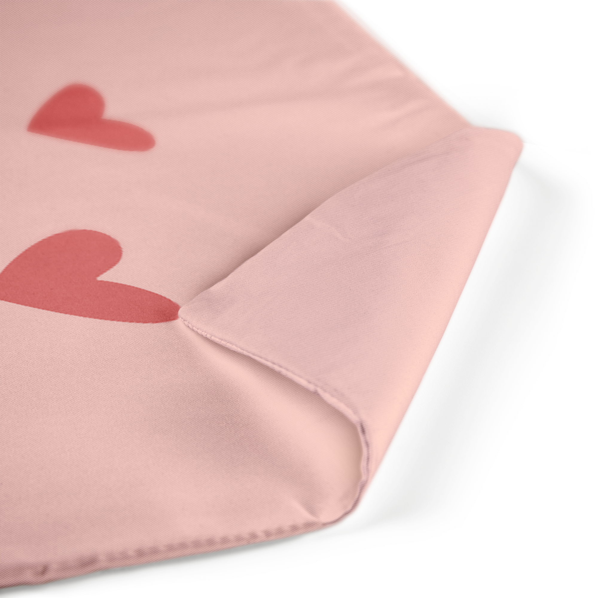 Coussin couleur rose pâle avec impression personnalisée de coeurs rouges