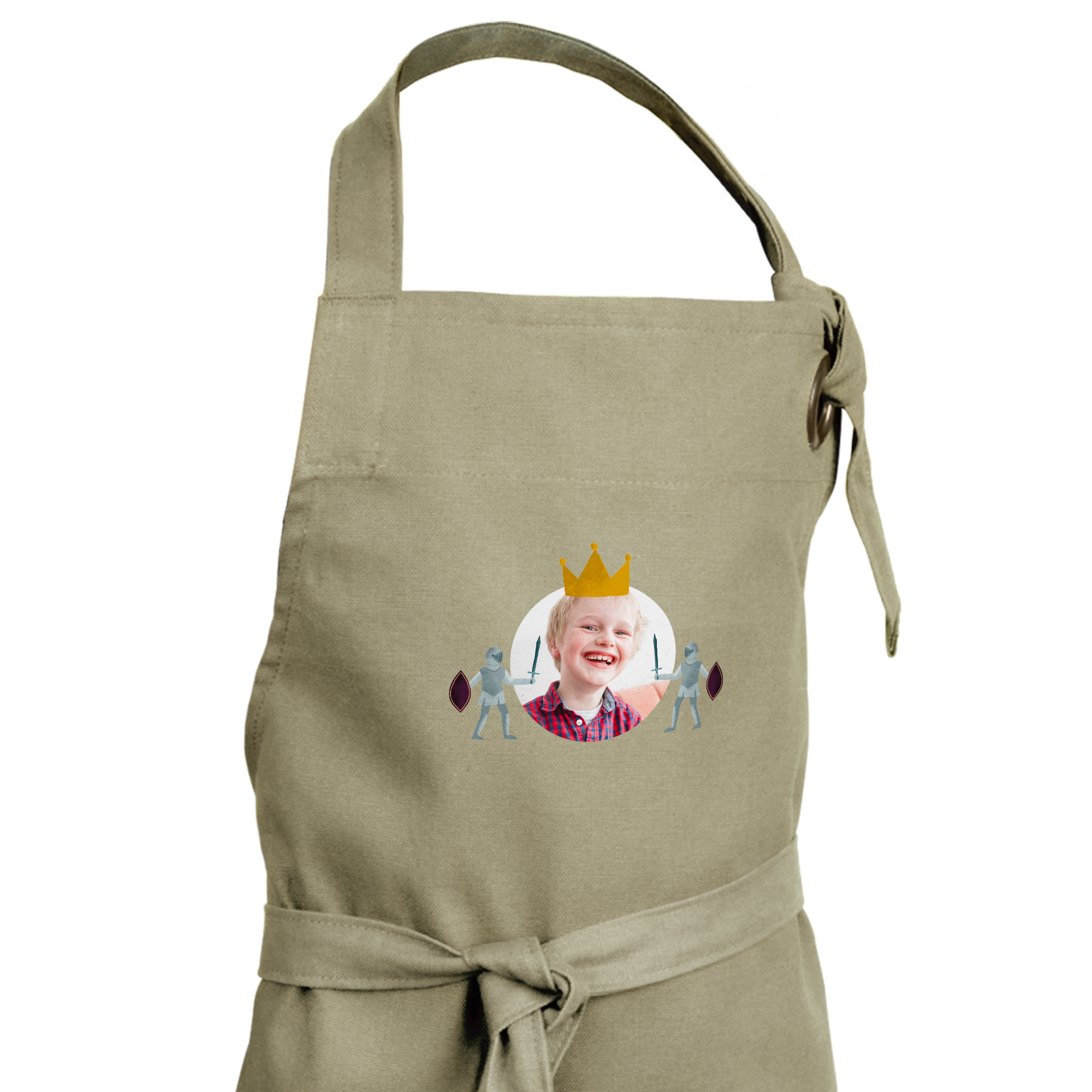 Tablier enfant beige personnalisé avec la photo d'un garçon souriant coiffé d'une couronne dorée imprimée.