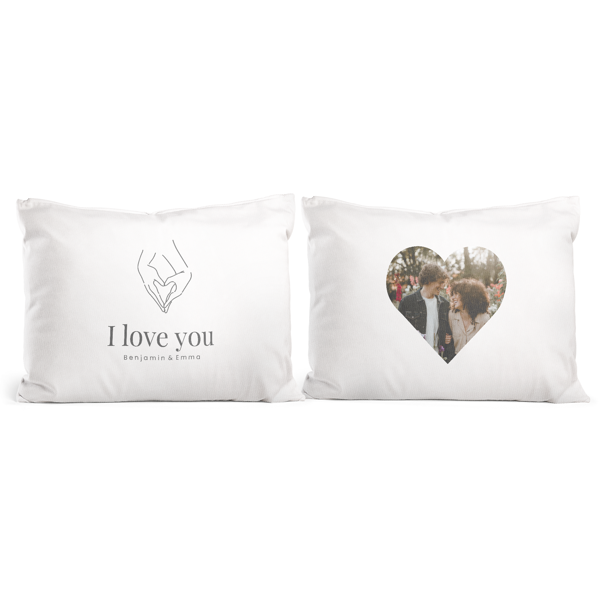 Un set romántico de fundas de almohada blancas, una estampada con la frase "I love you Benjamin & Emma" y la otra con una foto de pareja en forma de corazón.
