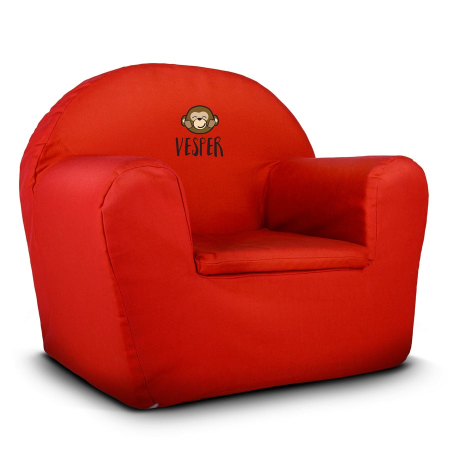 Red personalized toddler's chair printed with a cute monkey design and the name Vesper