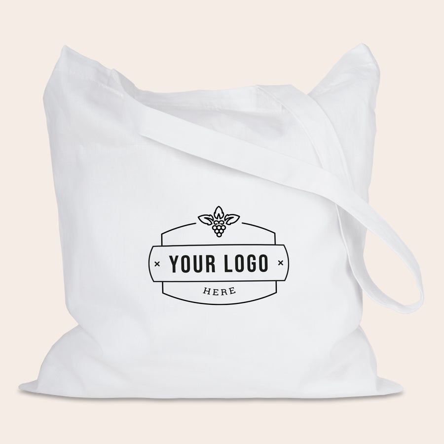 Tygpåse med tryck Vit personlig shoppingväska med "YOUR LOGO HERE" tryckt i svart, redo för din design och för att njuta av en personlig shoppingväska.