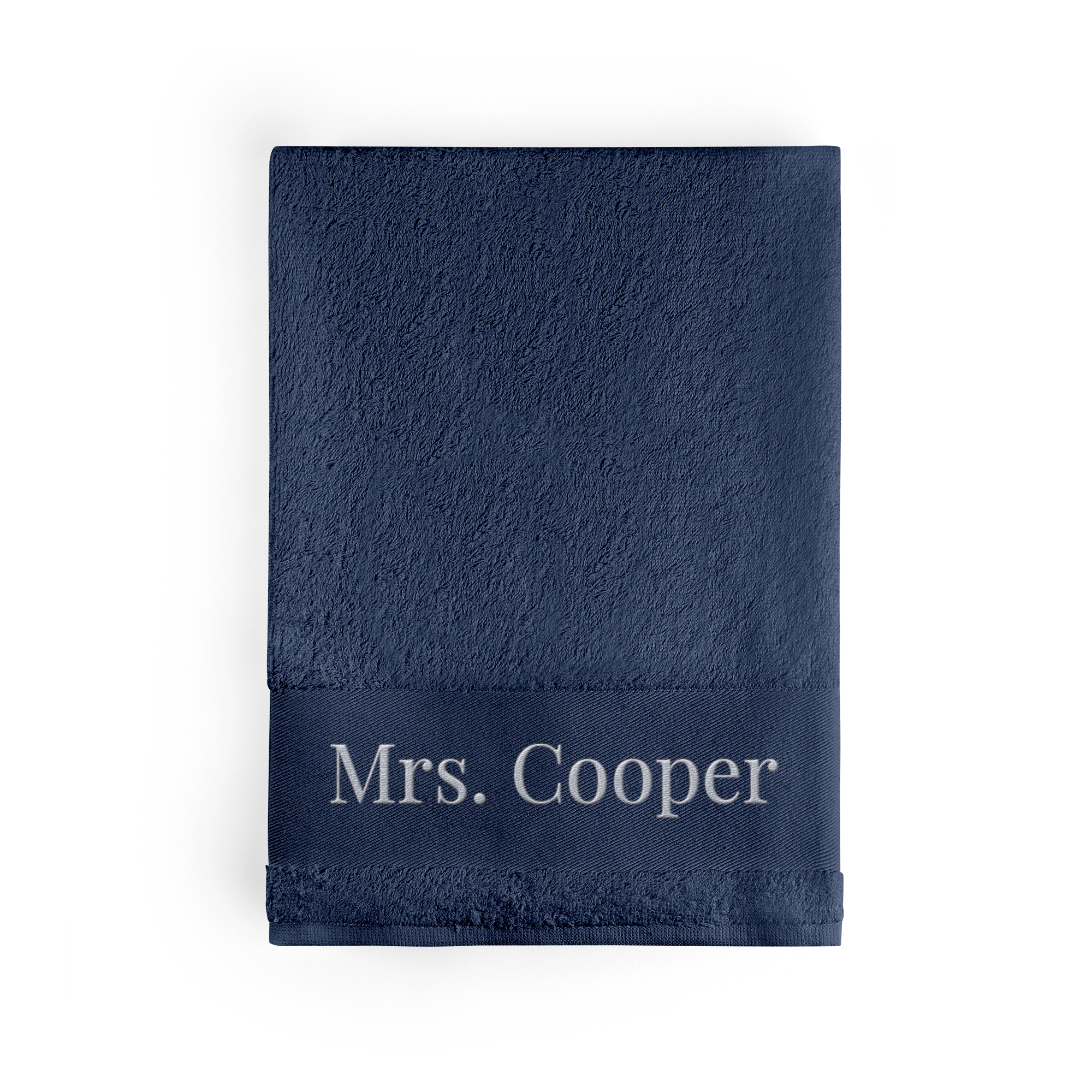 Personalised navy bath towel embroidered with Mrs Cooper in white thread