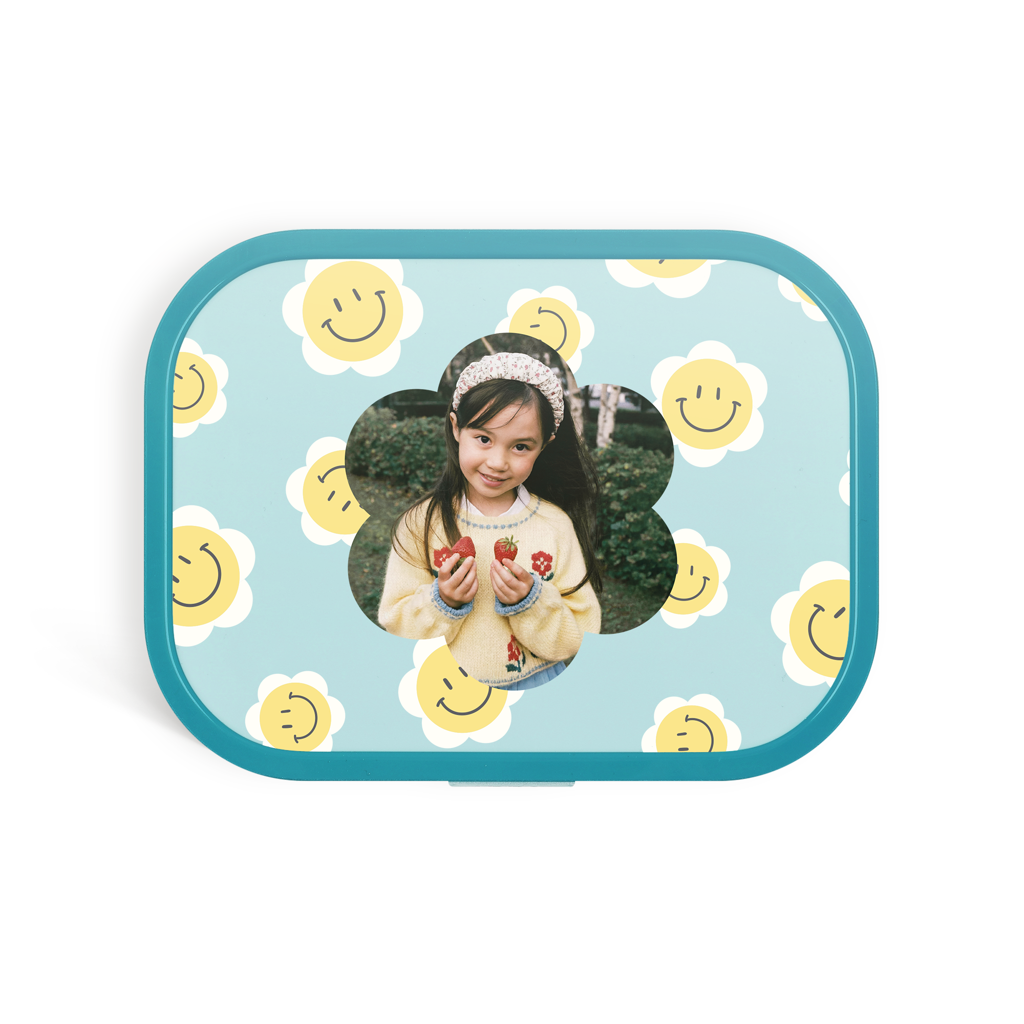 Niebieski lunchbox Mepal z nadrukowanym zdjęciem uśmiechniętej dziewczynki otoczonej uśmiechniętymi kwiatkami.