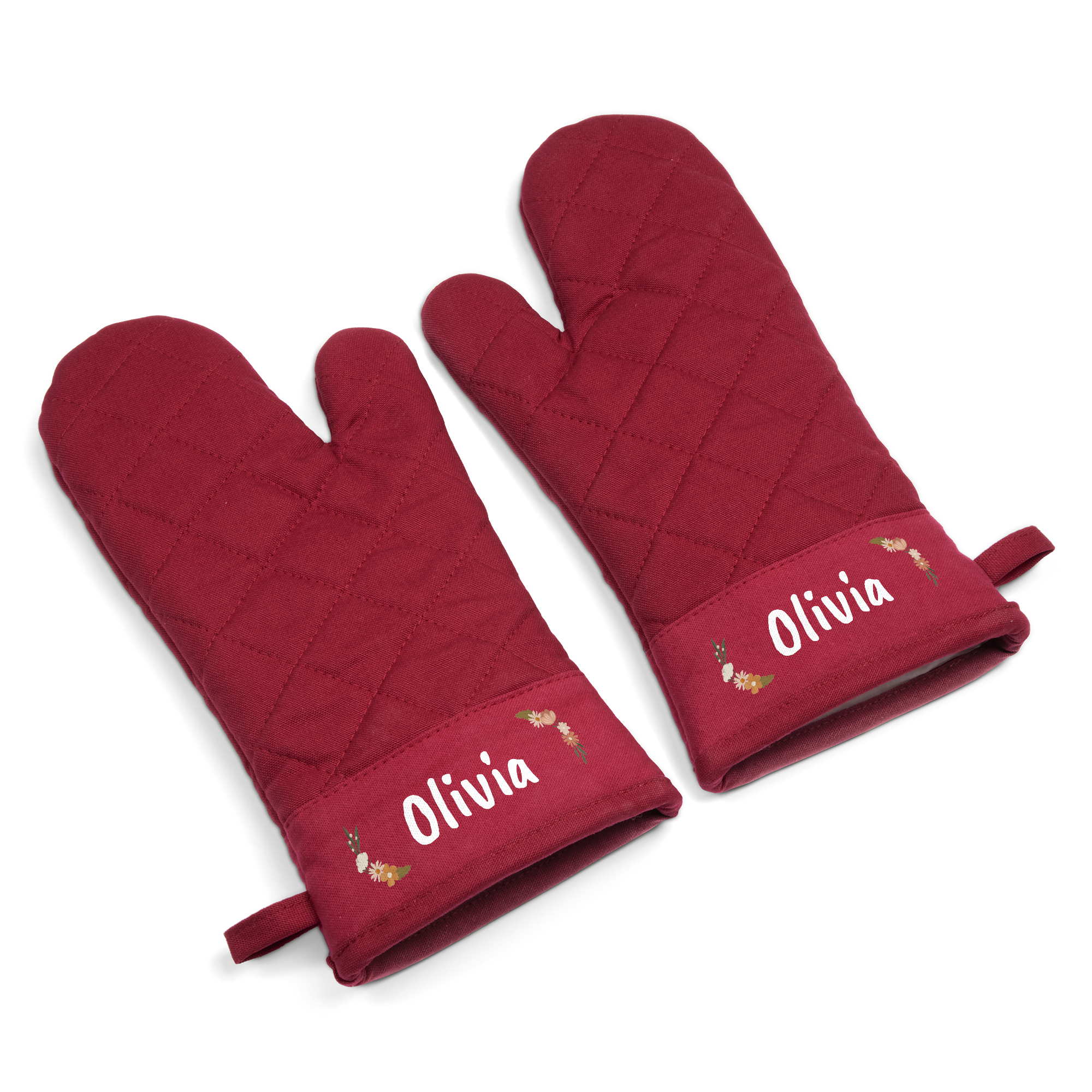 A pair of deep red quilted personalised oven gloves, printed with the name Olivia in white text and a floral design