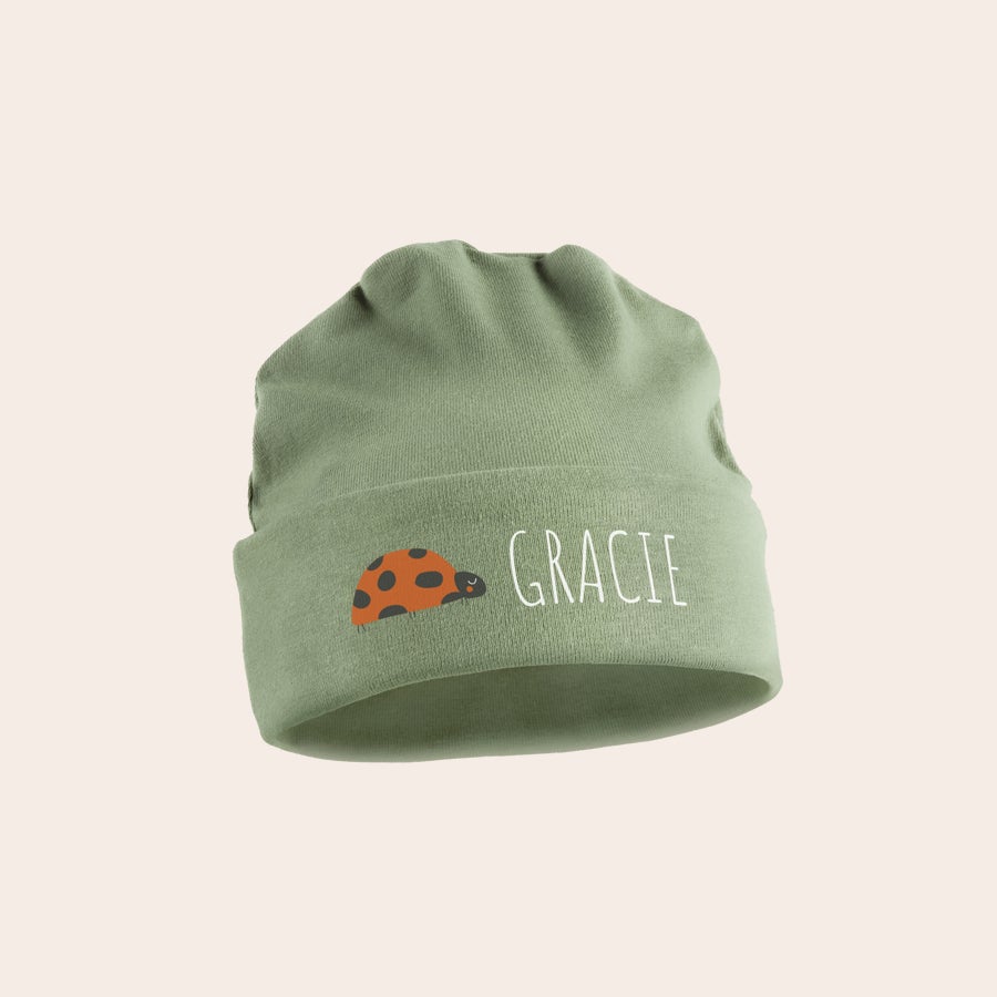 Personalised baby beanie Sage green personalized baby hat with a ladybug and the name Gracie printed on it
