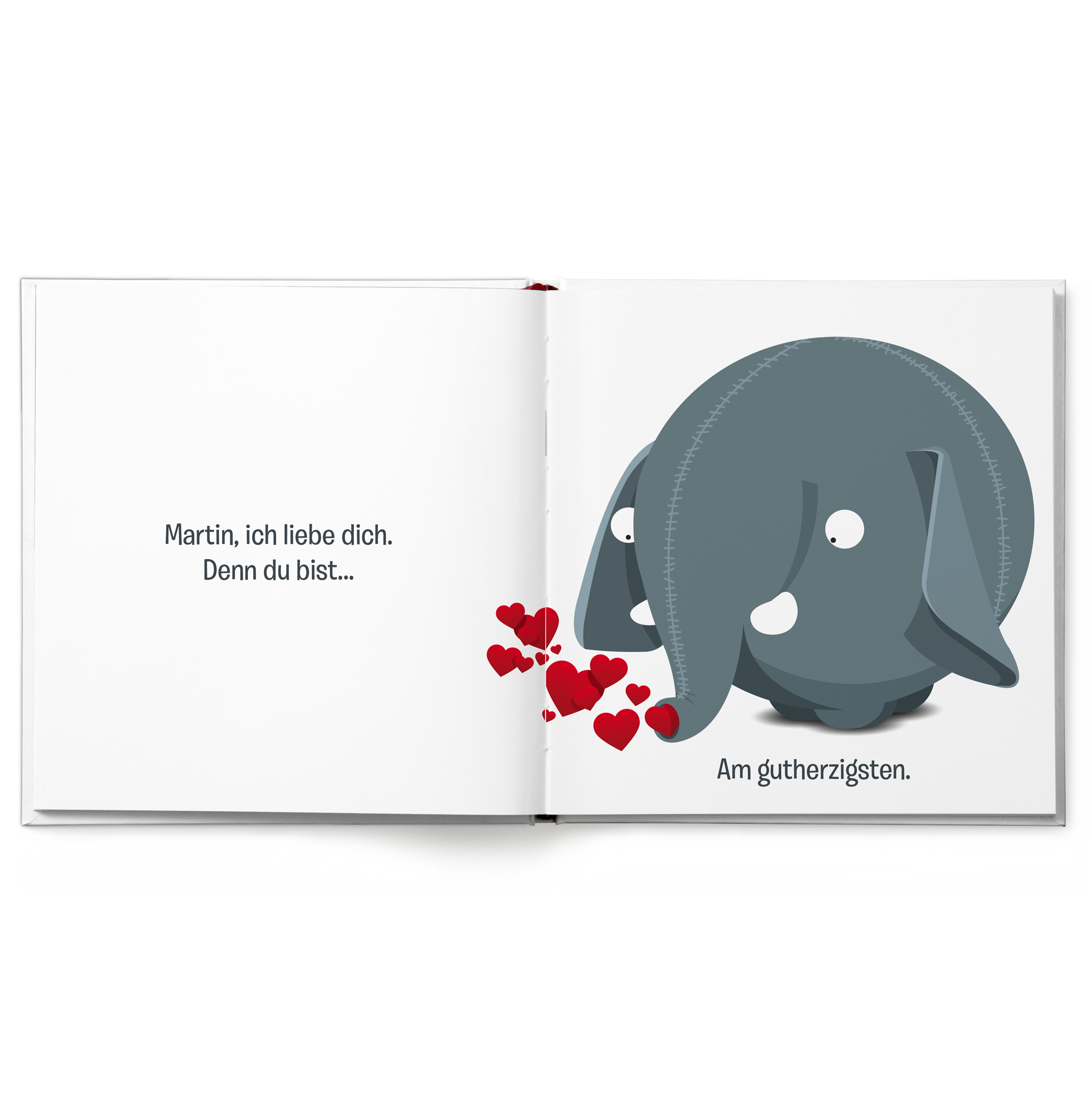 Personalisiertes Ollimania-Buch offen mit Text Martin ich liebe dich und Elefantenillustration mit Herzen.