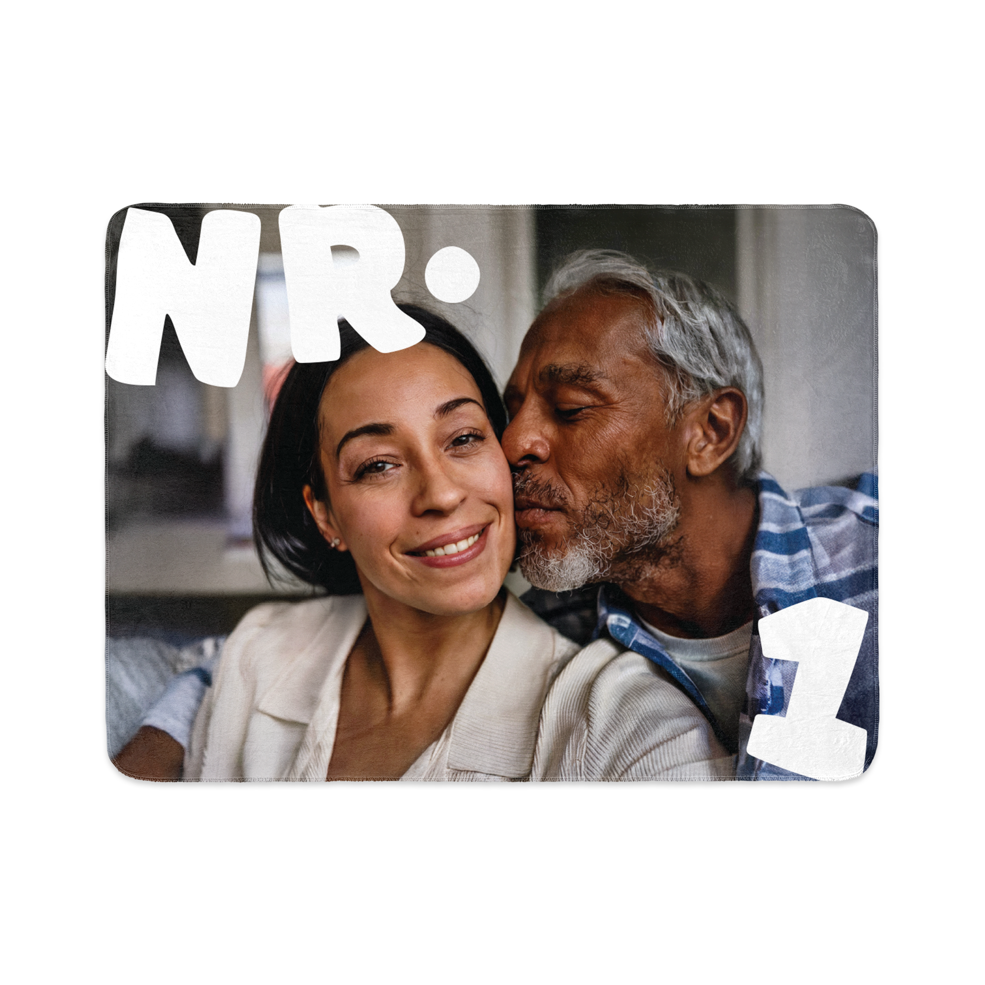Fleece photo blanket with a printed photo of a man kissing a woman and the text "NR 1" to get cosy with