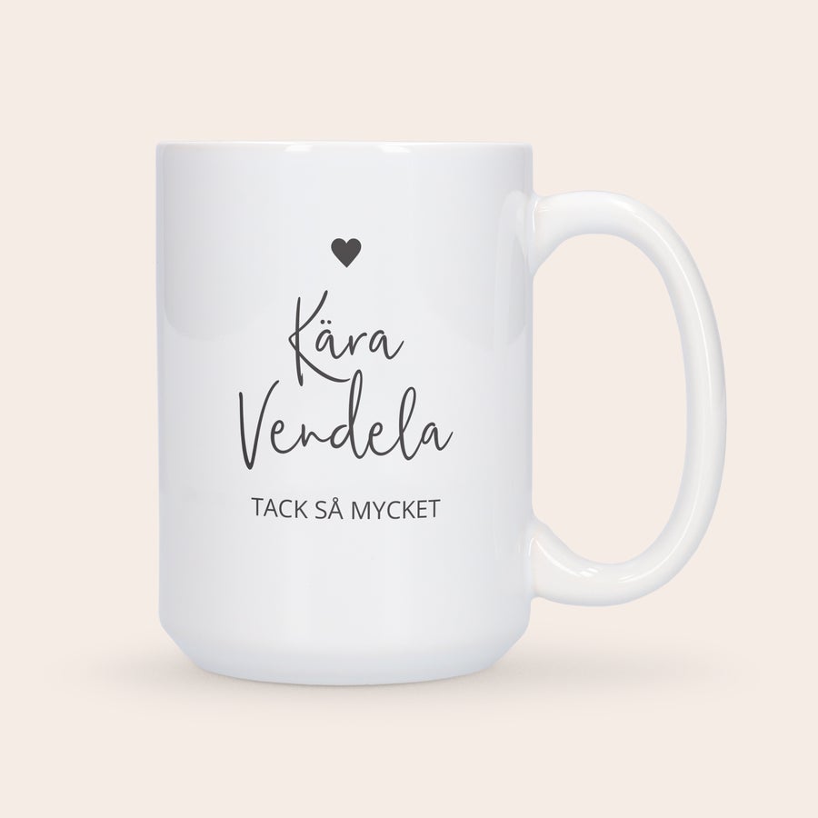 XXL-mugg med foto Vit XXL-mugg med tryckt svart text Kära Vendela Tack så Mycket och ett hjärta, perfekt för teälskare.