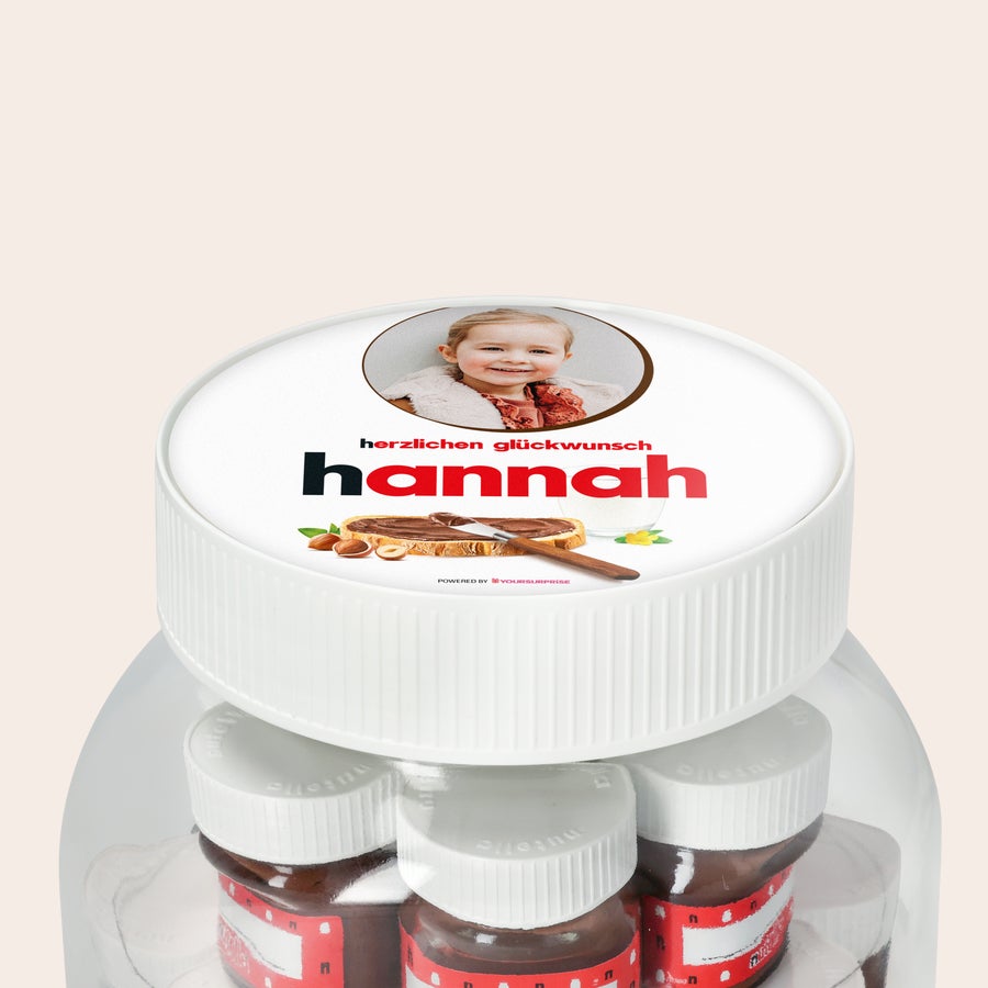 Personalisiertes nutella® Glas XL mit Namen und Foto Personalisiertes nutella® Glas XL mit Namen und Foto, bedruckt mit einem lächelnden Kind und dem Text Hannah.