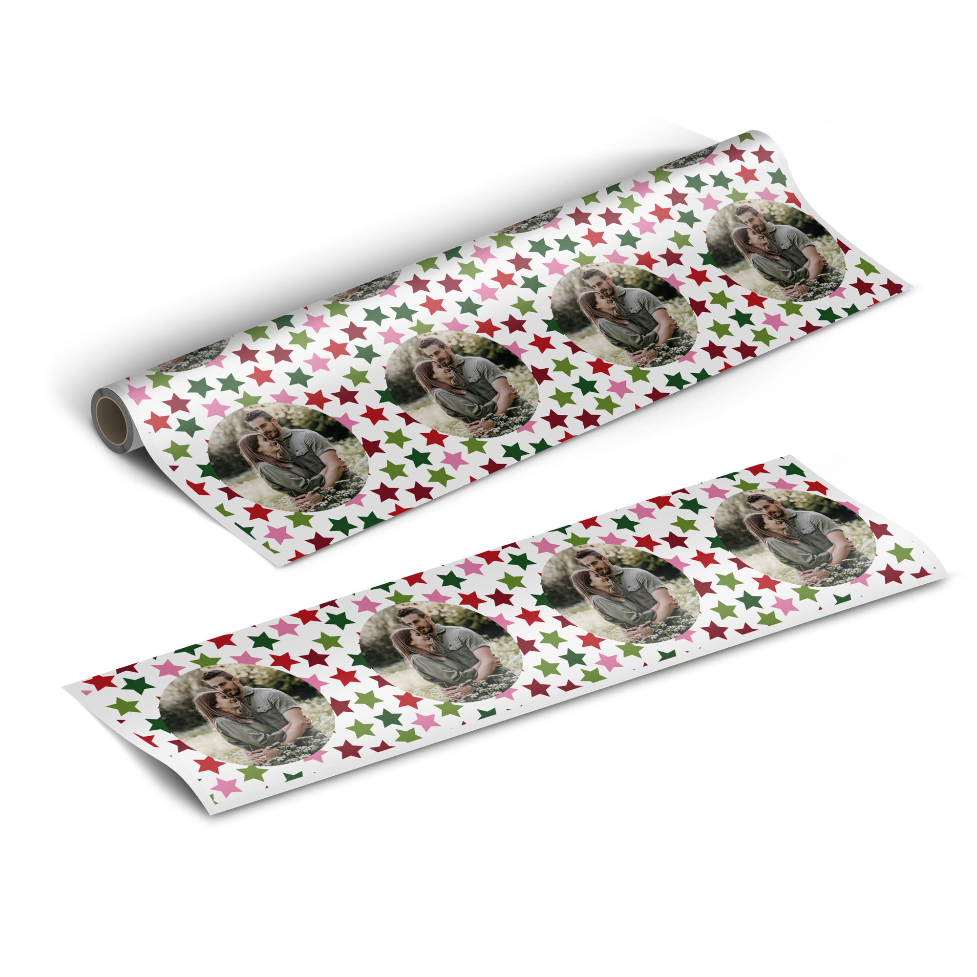 Two rolls of personalized wrapping paper with a pattern of red, pink, and green stars and printed photos of a couple.