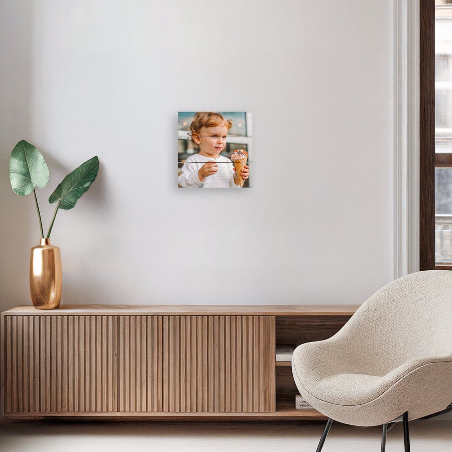 Photo on wood Personalized photo printed on wooden planks featuring a child holding an ice cream cone