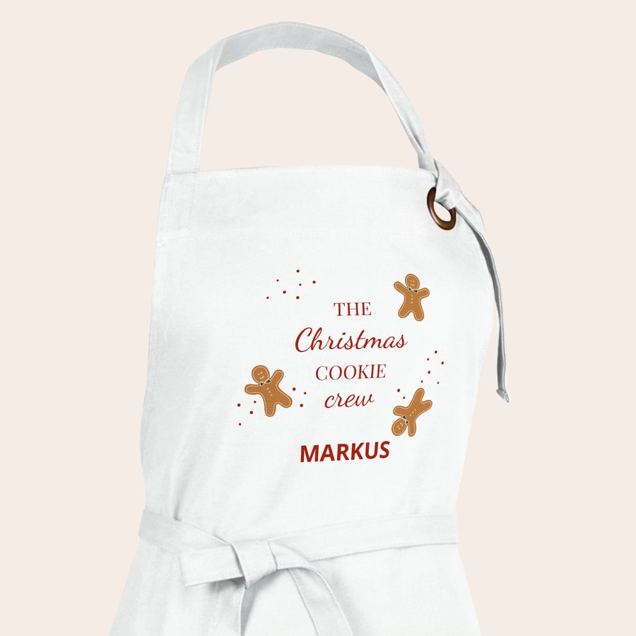 Schürze bedrucken Weiße persönliche Schürze bedruckt mit "The Christmas Cookie crew", Lebkuchenmännern und dem Namen Markus