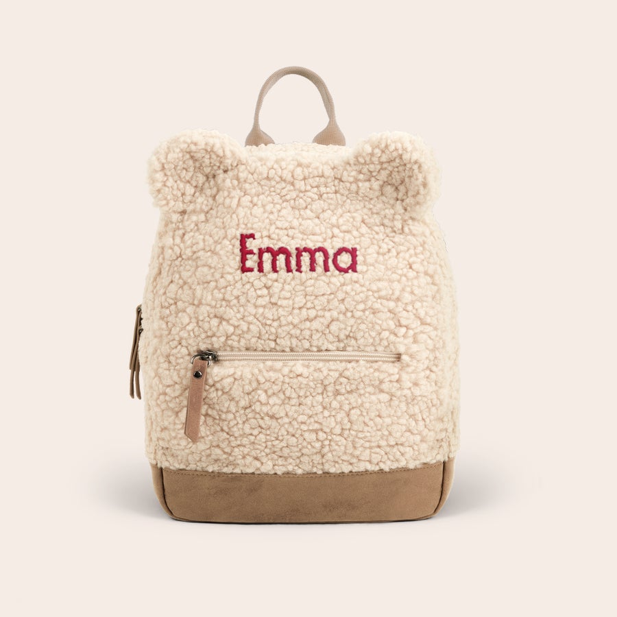 Personlig bamse rygsæk Blød cremefarvet børnerygsæk med broderet navn Emma og læderbund, klar til personalisering.