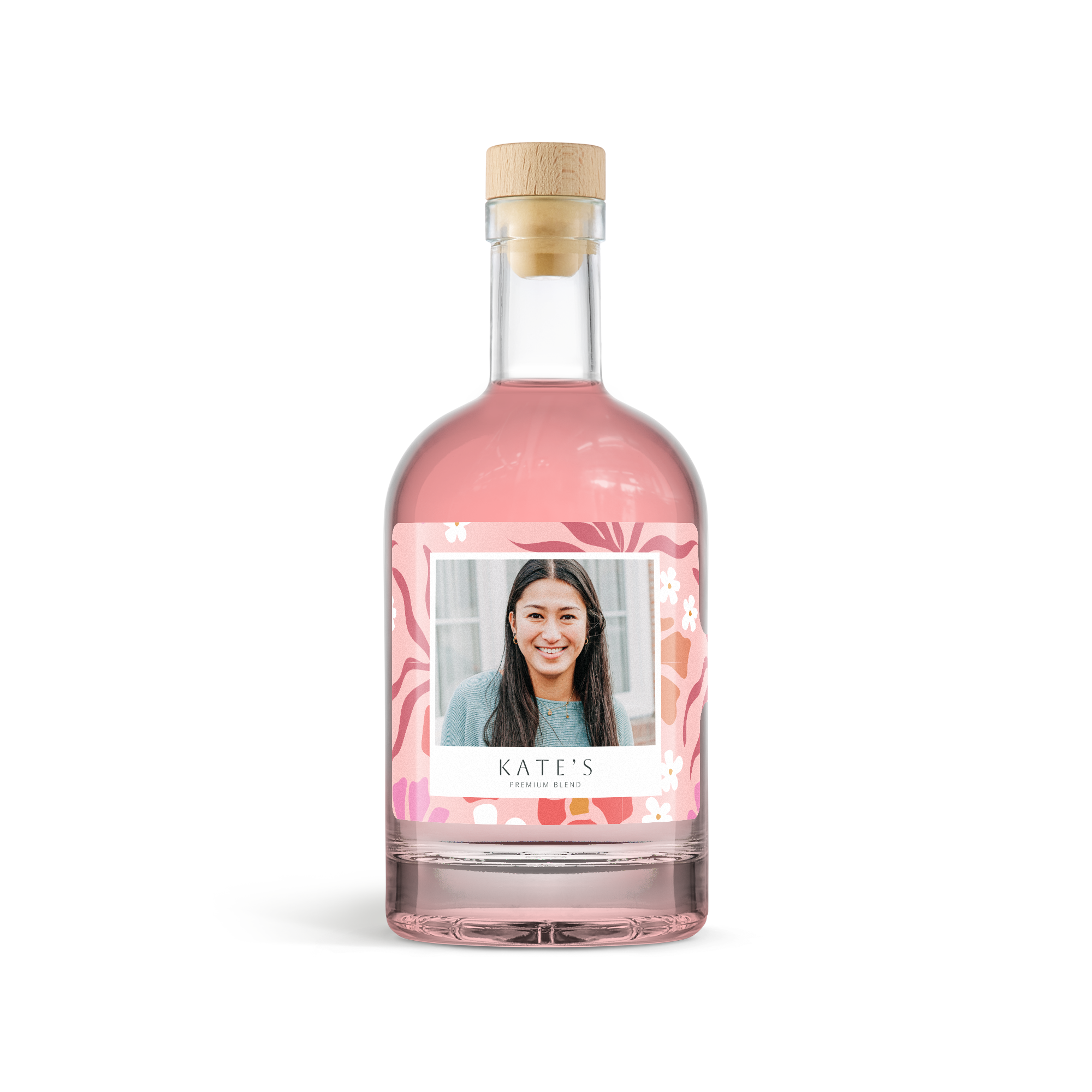 Personalised pink gin bottle with a photo of a woman and "Kate's" on the custom label