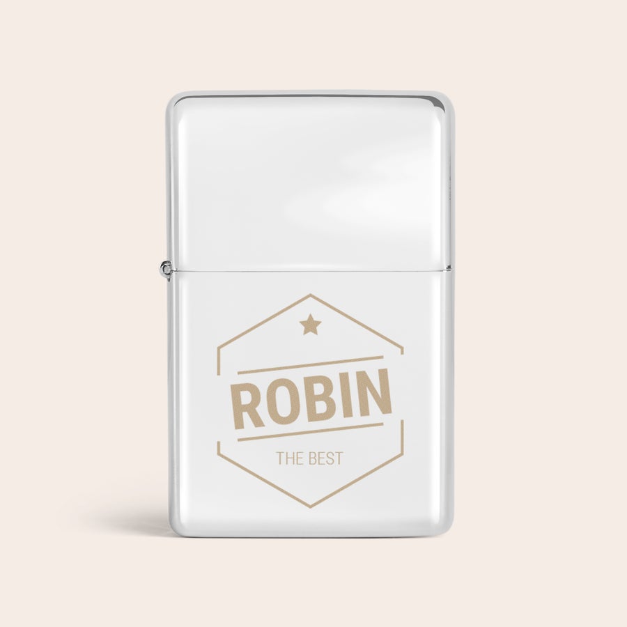 Brichete gravate Brichetă personalizată argintie cu numele ROBIN și textul THE BEST gravate, într-o flacără de eleganță.