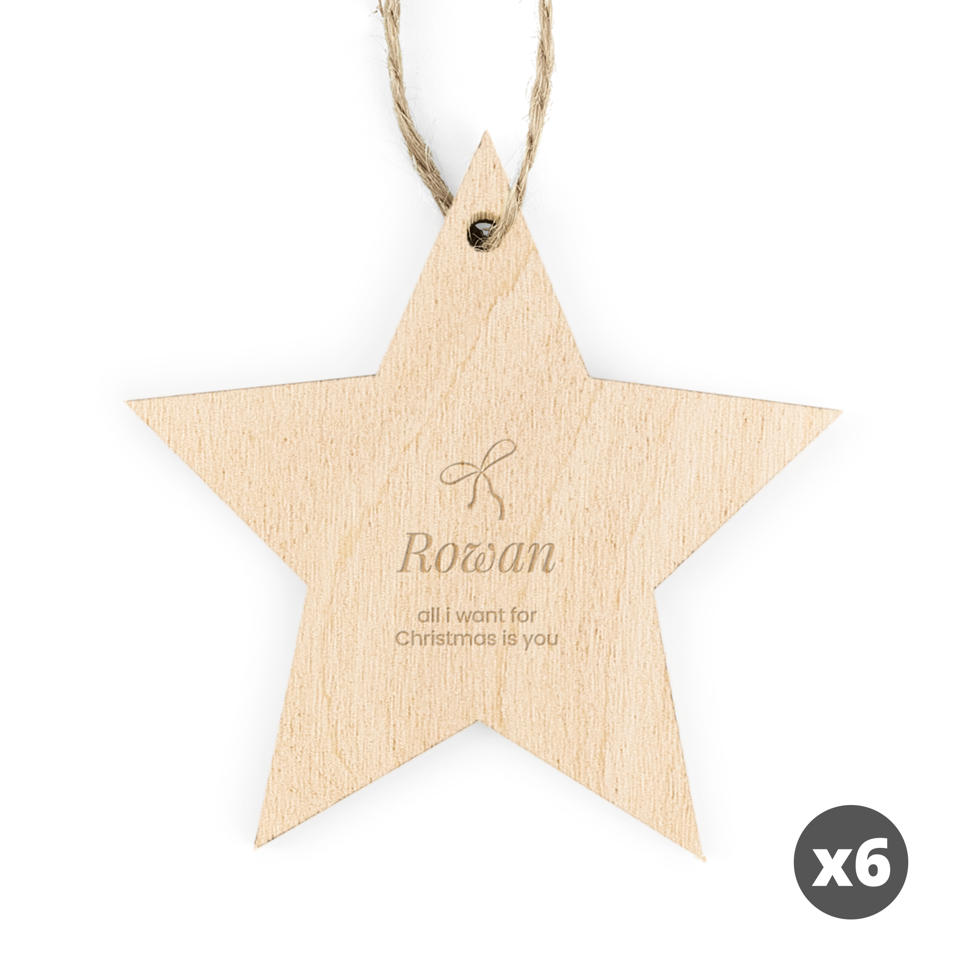 Drewniana gwiazdka z grawerem imienia Rowan i napisem all i want for Christmas is you jako ozdoby świąteczne