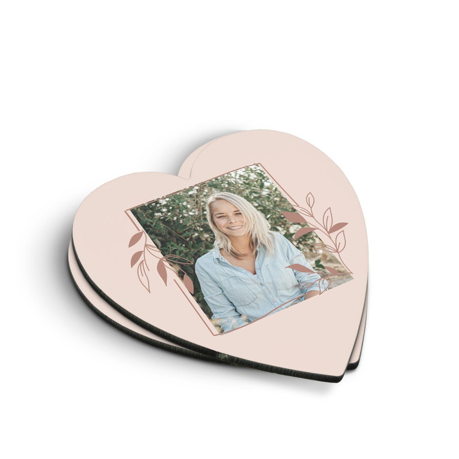 Coasters Heart-shaped personalized coasters with a printed photo of a smiling woman framed by delicate leaf designs