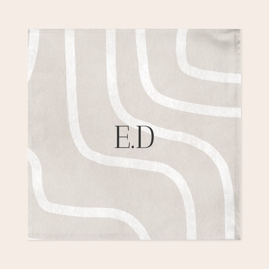 Personalised napkins Personalised napkins with a light tan abstract wavy design and dark grey printed initials ED