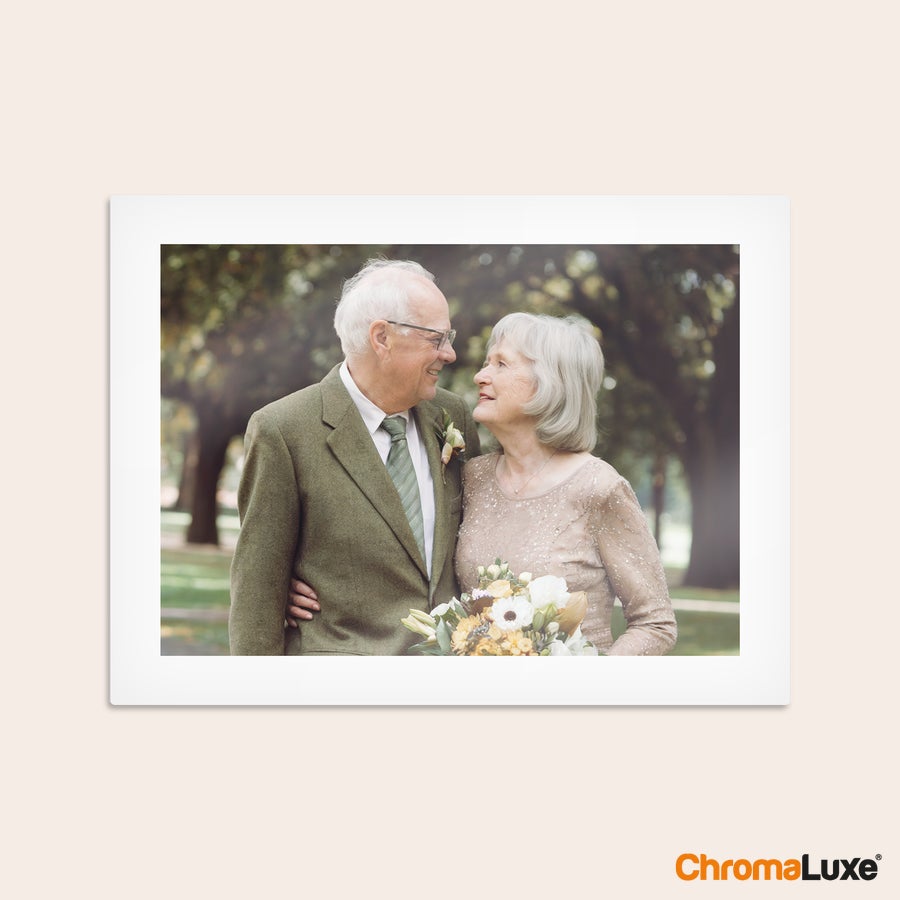 Aluminium photo panel Chromaluxe aluminium photo print of an older couple embracing with a bouquet of flowers, featuring personalized memories