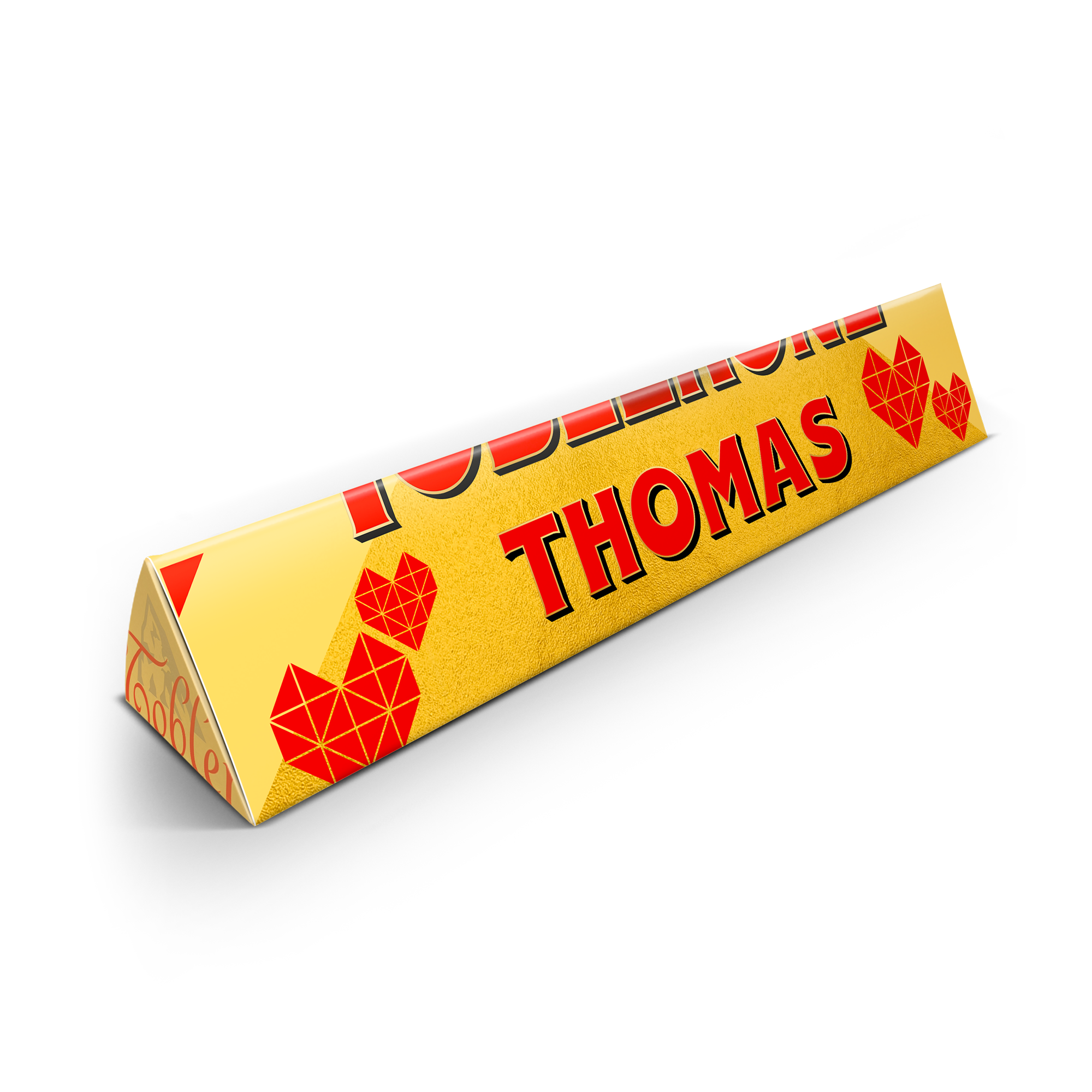 Barra de Toblerone personalizada con nombre THOMAS en rojo y corazones impresos sobre el envoltorio amarillo.
