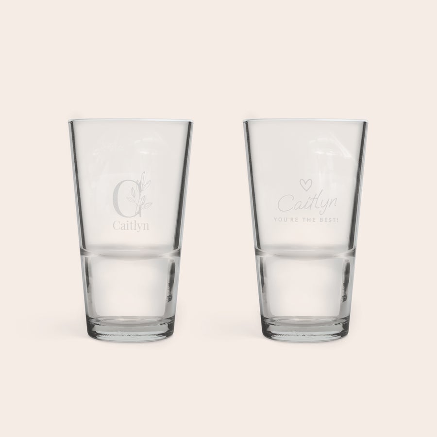 Beer Glass 340 ml Two personalised half pint glasses, one engraved with an ornate C and the name Caitlyn, the other with Caitlyn You're the Best and a heart.