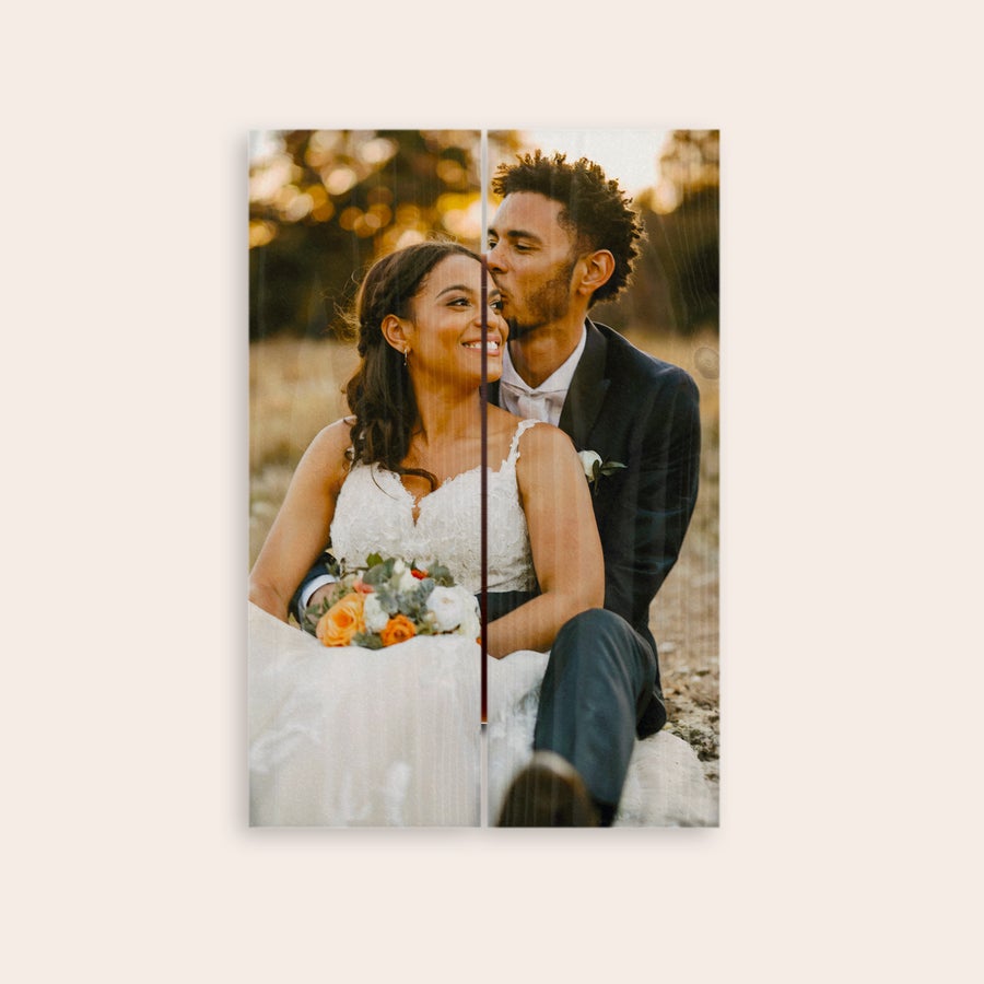 Photo on wood Custom photo printed on wooden planks, showing a couple in wedding attire.