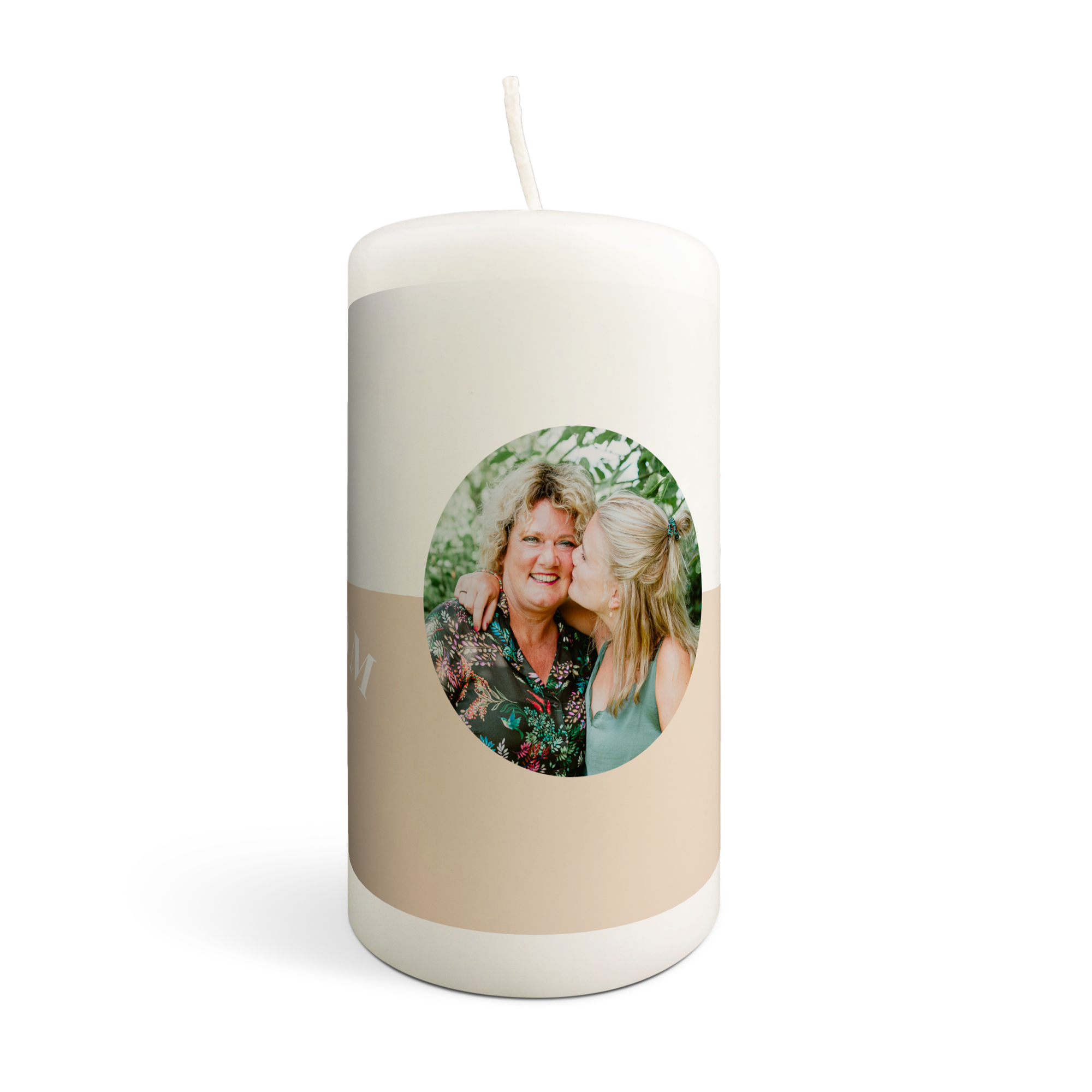 Personalized candle with a printed photo of a woman kissing another woman's cheek on a two-tone beige design