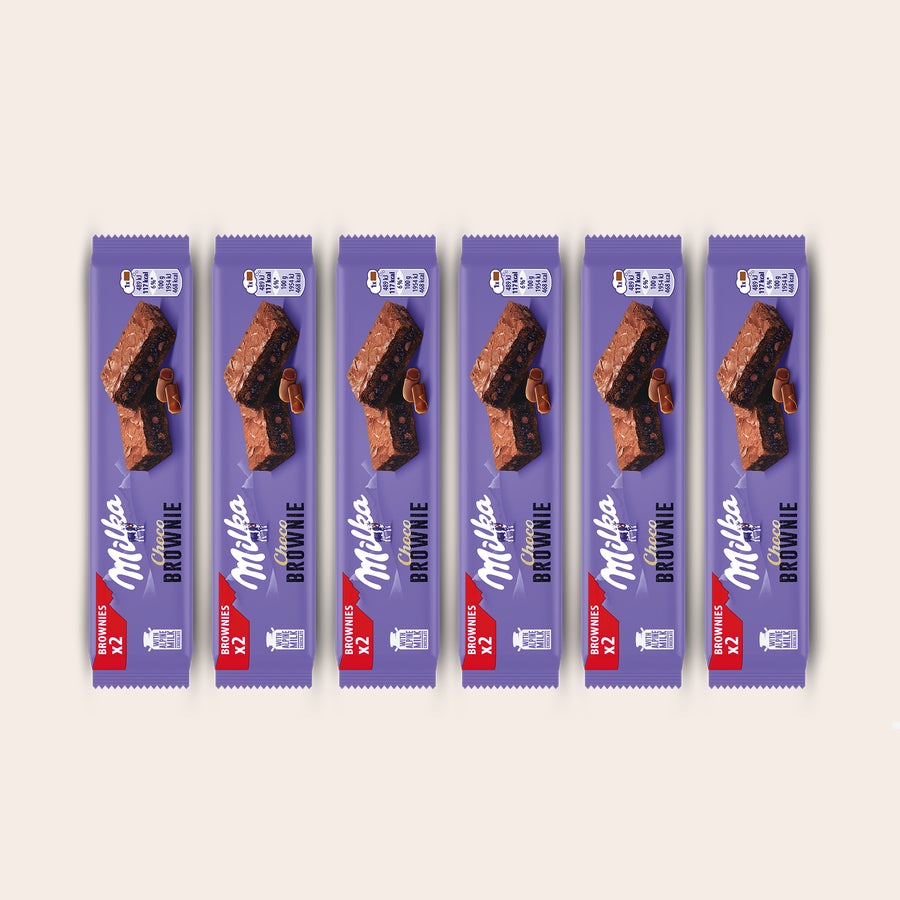 Milka Brownies Seis embalagens roxas de Milka Choco Brownie com letras brancas, perfeitas para surpreendê-los com uma caixa de presente personalizada Milka Choco Brownie.