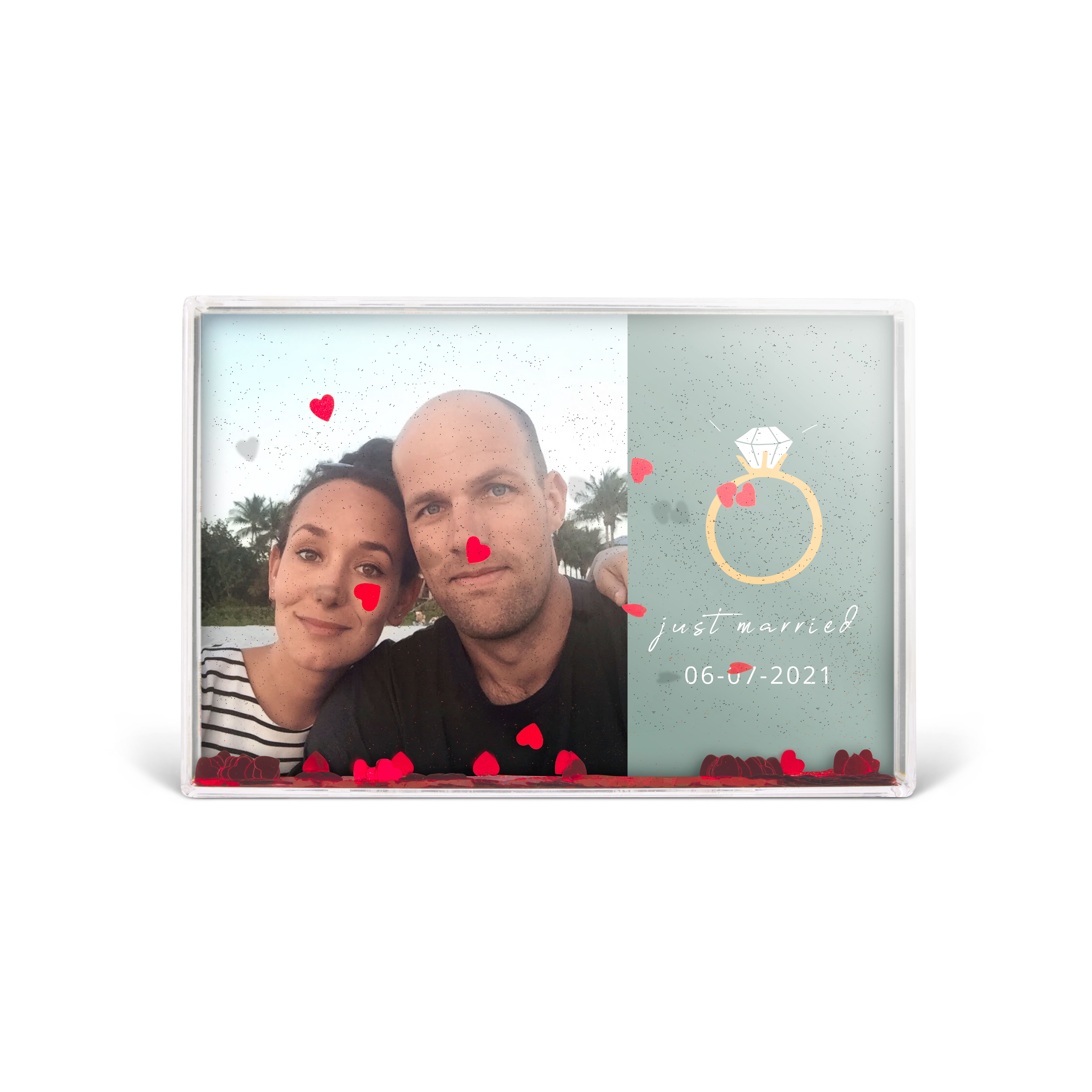 Personalised snow globe picture frame with photo and "just married 06-07-2021" text, filled with hearts