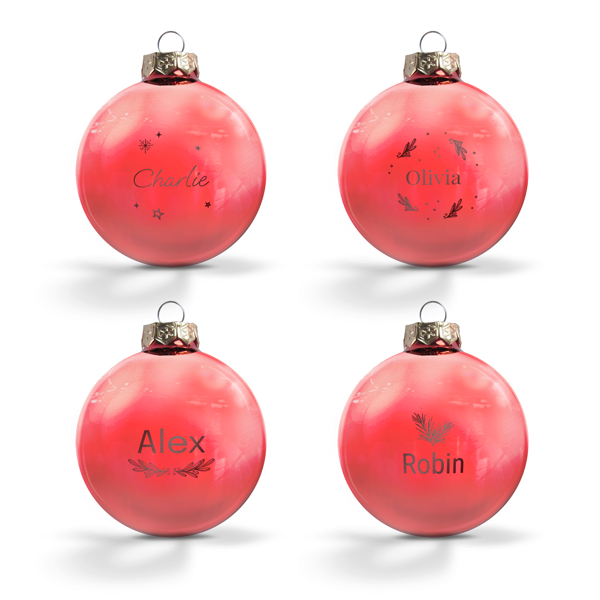 Quattro palline di Natale personalizzate rosa con nomi incisi come Charlie Olivia Alex e Robin