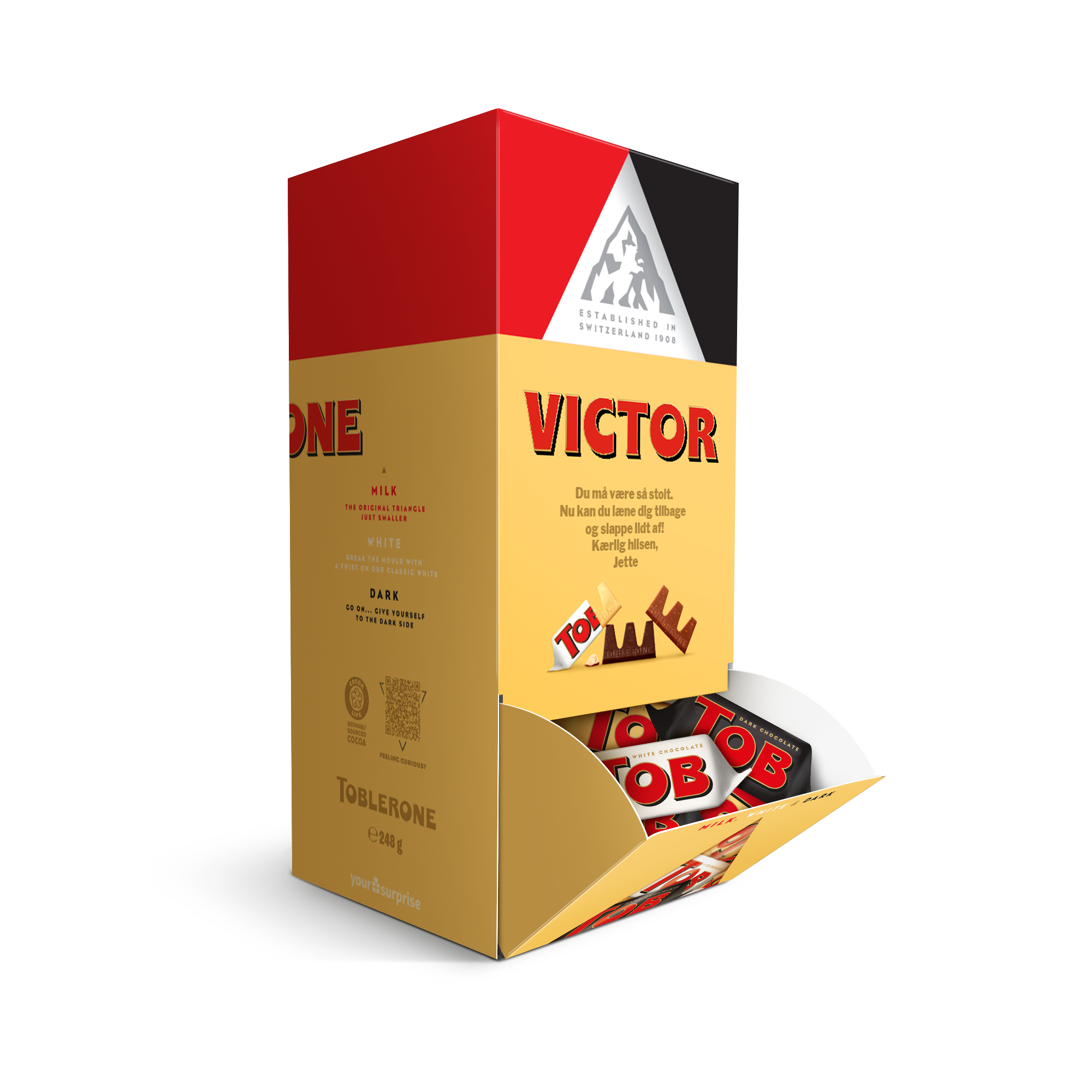 Personlig Toblerone-chokoladedispenser i guld og rød med printet navn "Victor" og besked "Kærlig hilsen, Jette".