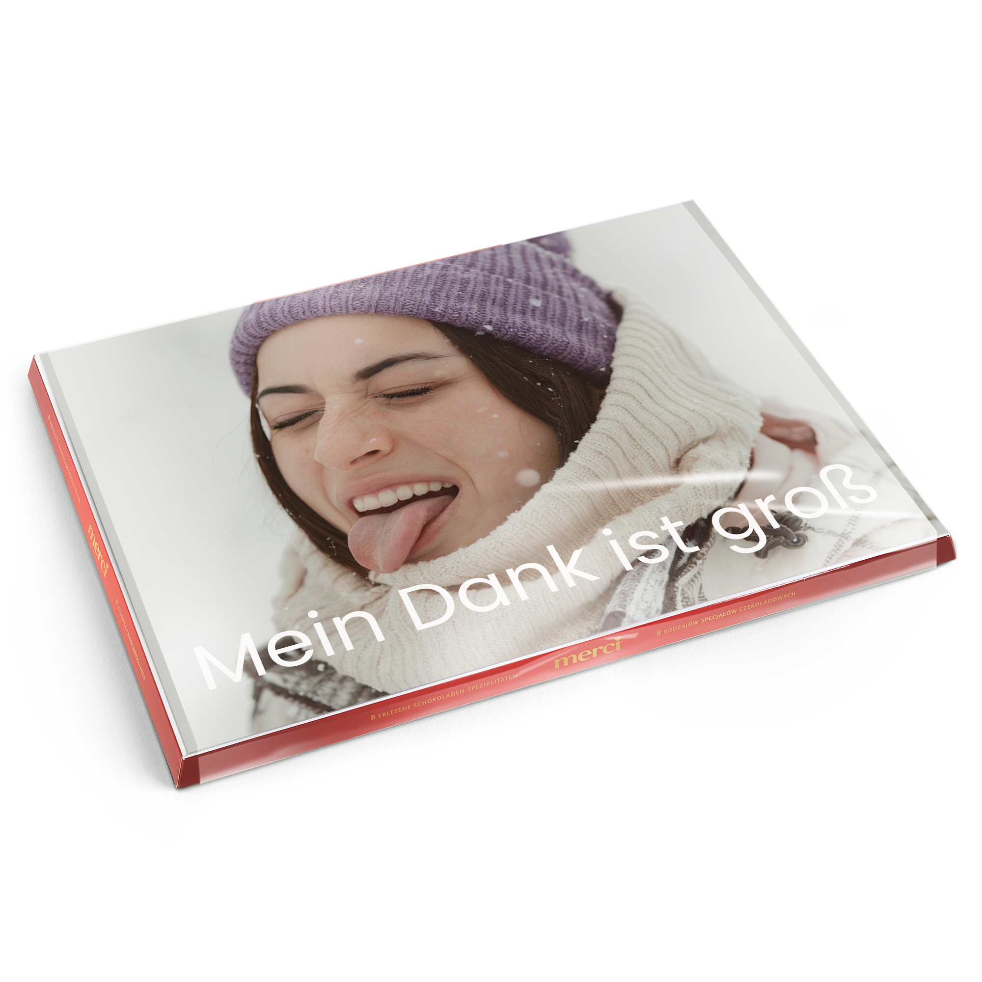 Merci Schokolade mit personalisierter Karte, bedruckt mit einem Foto einer jungen Frau und der Aufschrift Mein Dank ist groß