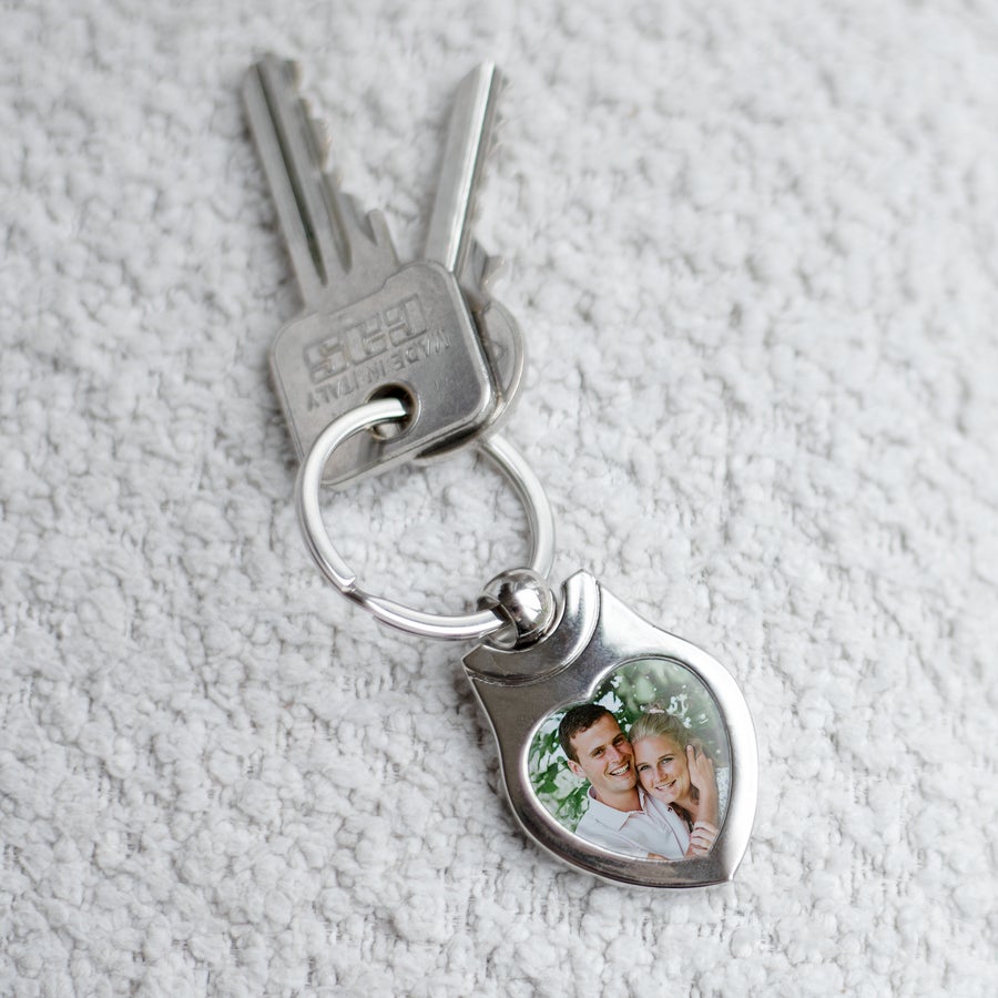 Personalised key ring - Stainless steel Silver heart-shaped keyring with a photo of a smiling couple printed inside, attached to two keys