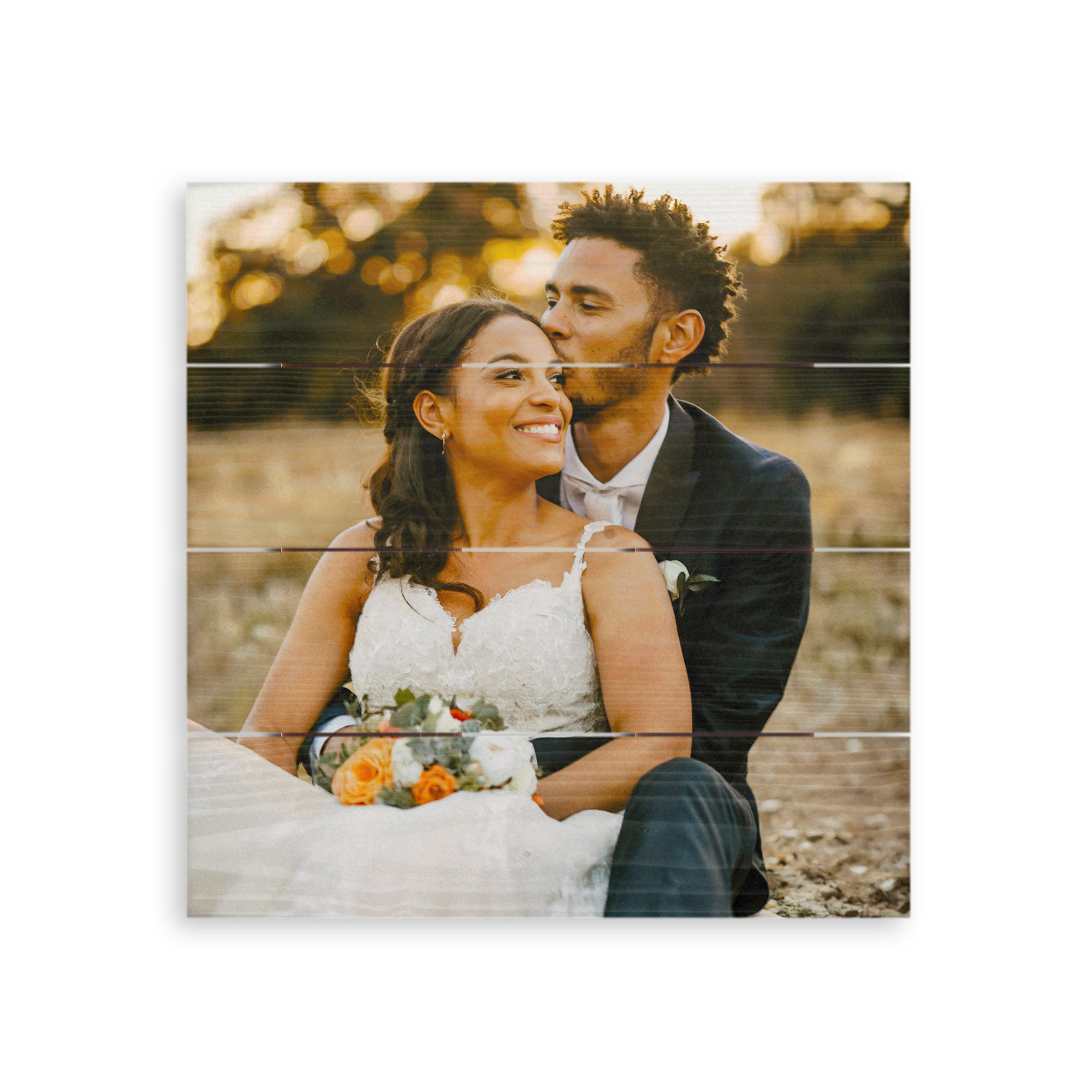 Whitewashed photo printed on wooden planks, showing a personalized wedding photo of a happy couple
