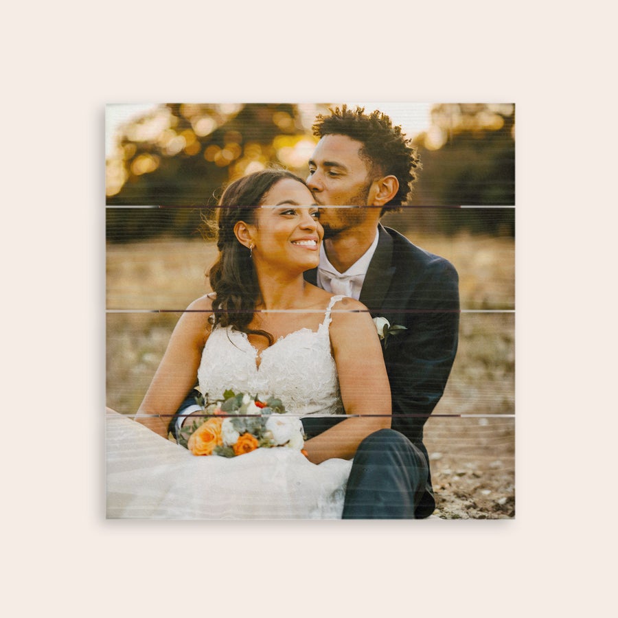 Photo on wood Whitewashed photo printed on wooden planks, showing a personalized wedding photo of a happy couple