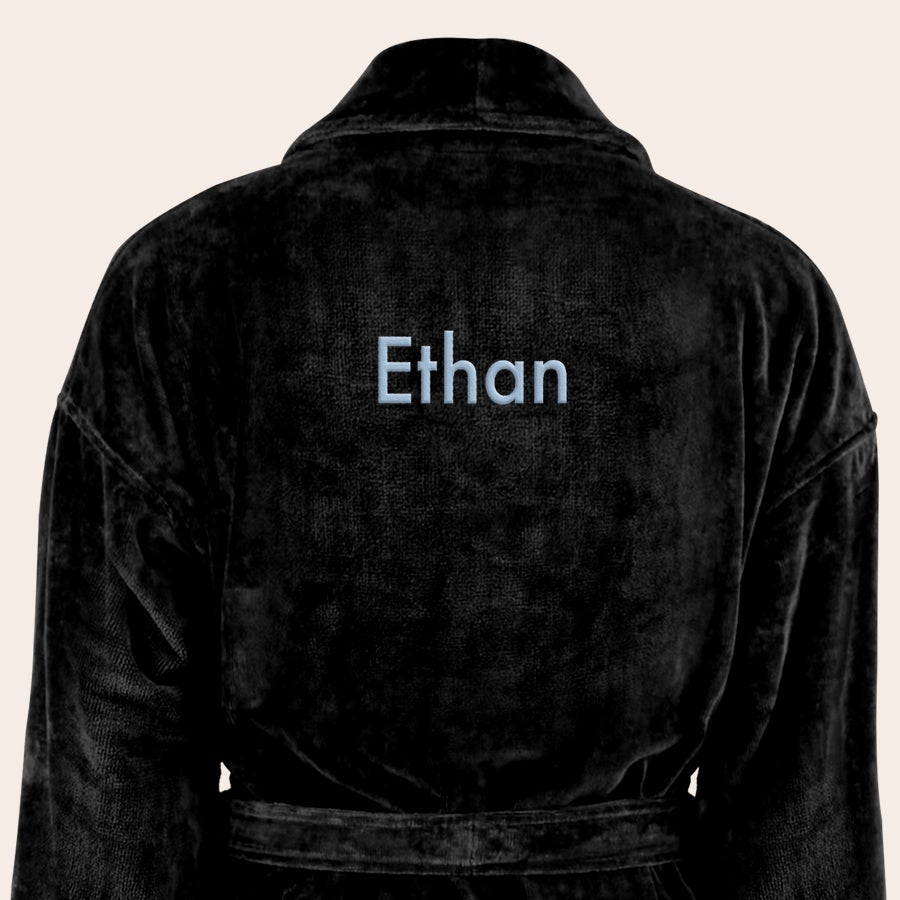 Bathrobe - Men Black personalised bathrobe with the name Ethan embroidered in light blue text on the back.