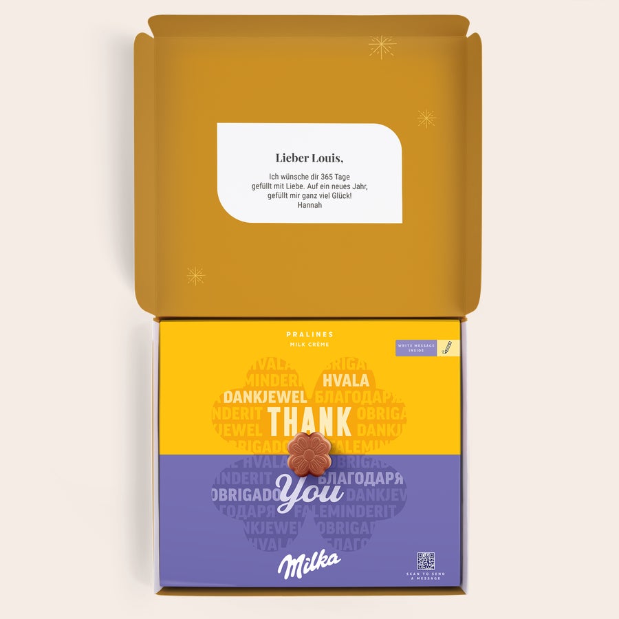 Milka Pralinen Weihnachten Personalisierte Milka Geschenkbox mit "Thank You" und Blumenschokolade, bedruckt mit "Lieber Louis" und Grußbotschaft von Hannah.