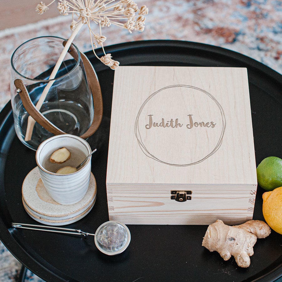 Wooden tea box with engraved lid