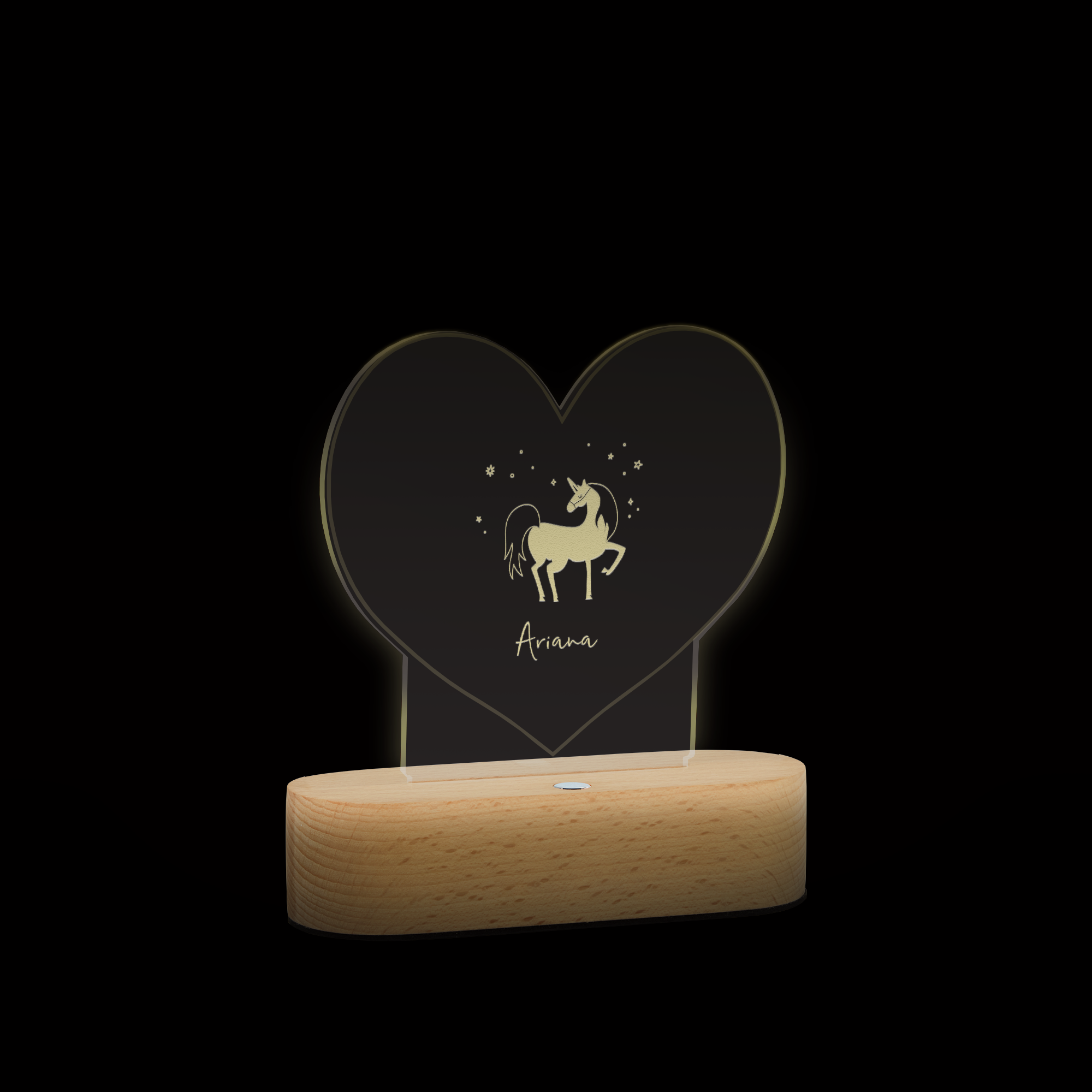 Herzförmige Lampe mit Gravur, zeigt ein Einhorn und den Namen Ariana, mit Holzsockel.