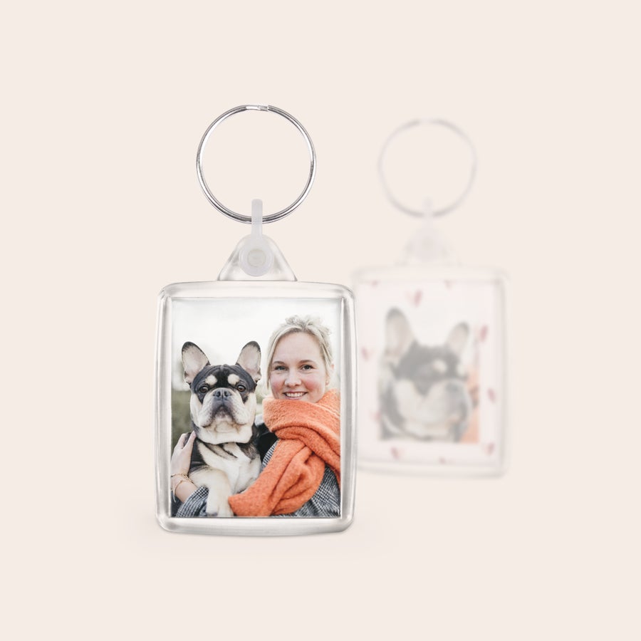 Personalised Logo Key Rings A clear set of personalized keychains printed with a photo of a woman holding a small dog.
