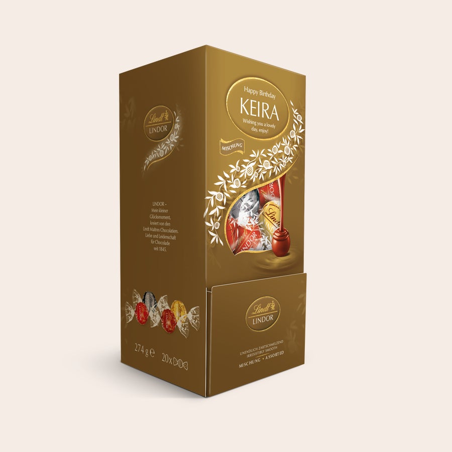 Lindt Dispenser Personalizovaná čokoládová darčeková krabička Lindt s nápisom Happy Birthday Keira a zlatým vzorom.