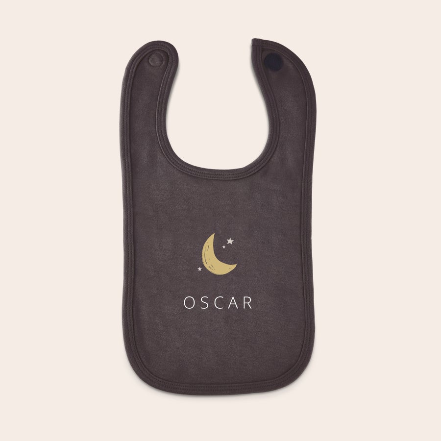 Personalised baby bib Dark grey personalized bib printed with a crescent moon three stars and the name Oscar