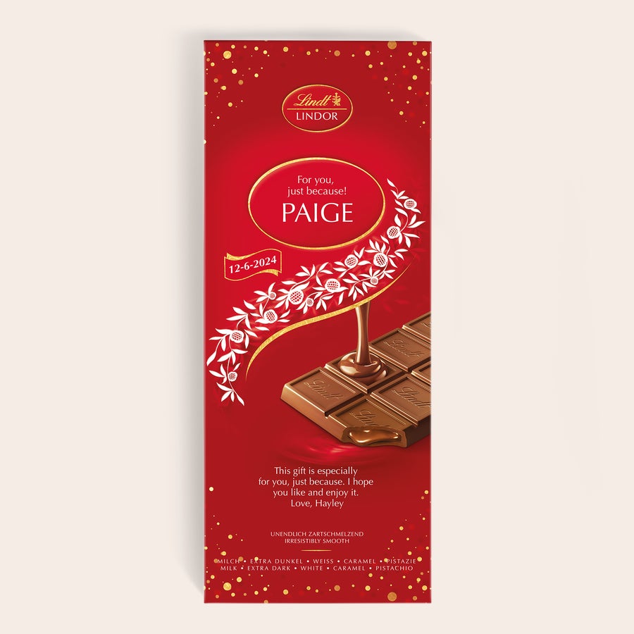 XL Lindor čokoladna ploščica To čokoladno darilo XL Lindor je vrhunsko presenečenje, personalizirano z imenom Paige in datumom 12-6-2024, natisnjeno na rdeči embalaži z zlatimi pikami.
