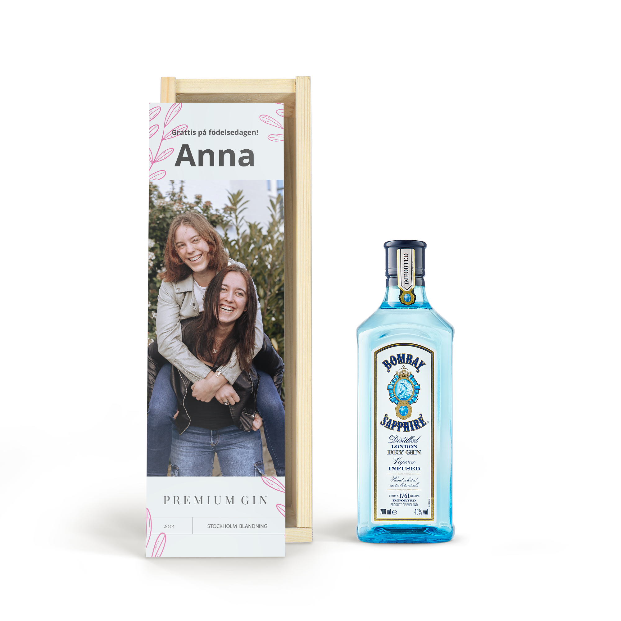 Överraskning med en läcker flaska Gin Bombay Sapphire i ett personligt fodral, tryckt med en bild och "Grattis på födelsedagen! Anna"