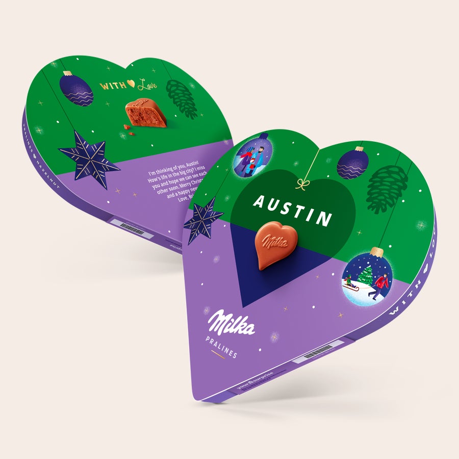 Corazón de Navidad Milka con nombre y foto Corazón Milka personalizado con nombre Austin y un mensaje, presentado en una caja decorada de Navidad.