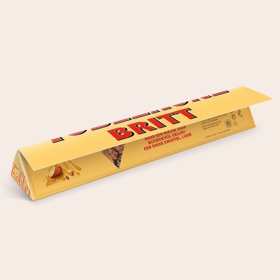 Toblerone met naam Toblerone reep met naam en foto - 100 gram, gepersonaliseerd met de naam BRITT en een foto.
