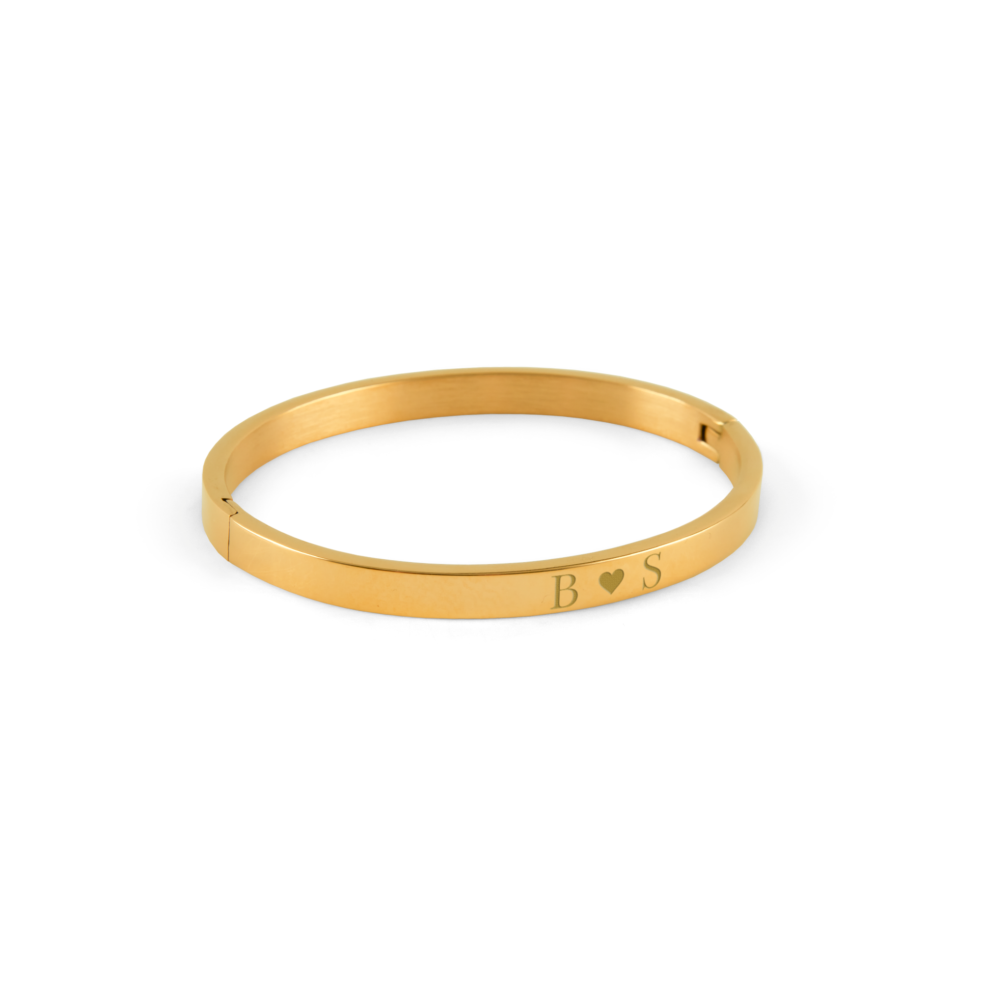 Jonc doré gravé, avec les initiales B cœur S, un cadeau personnalisé pour une femme.